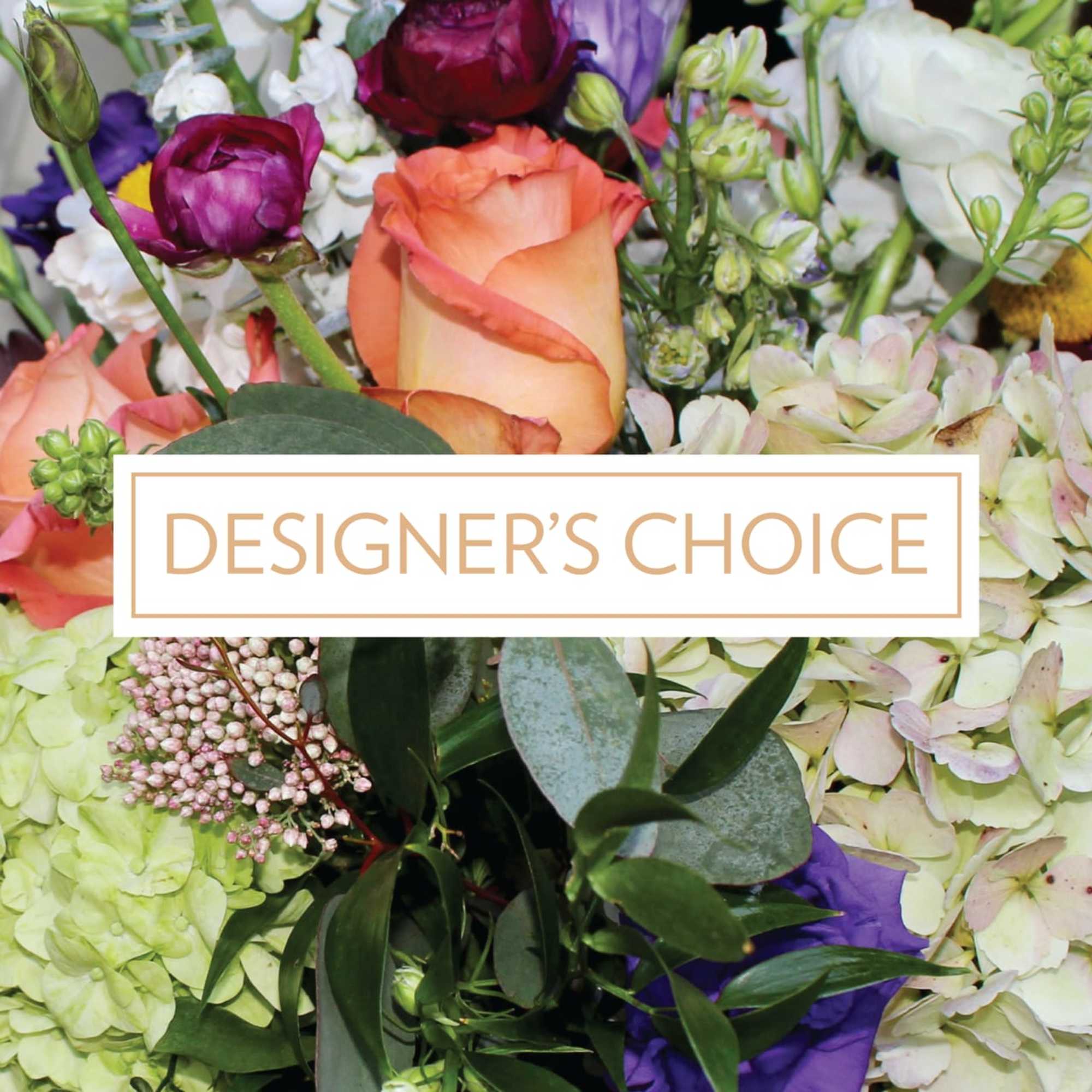 Colorful designer's choice bouquet with peach roses, purple blooms, and pale hydrangeas