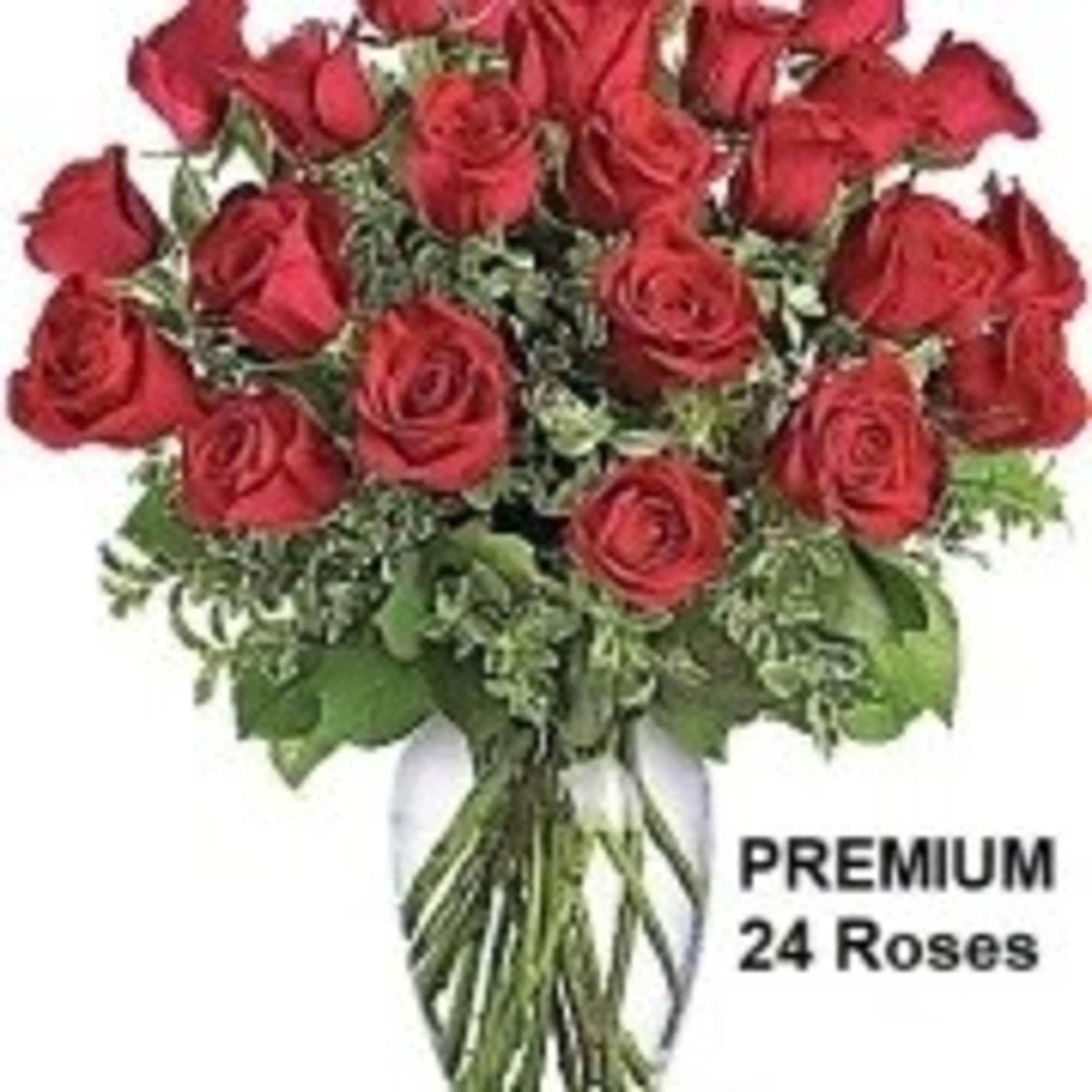 Arrangement of two dozen red roses in a clear glass vase.