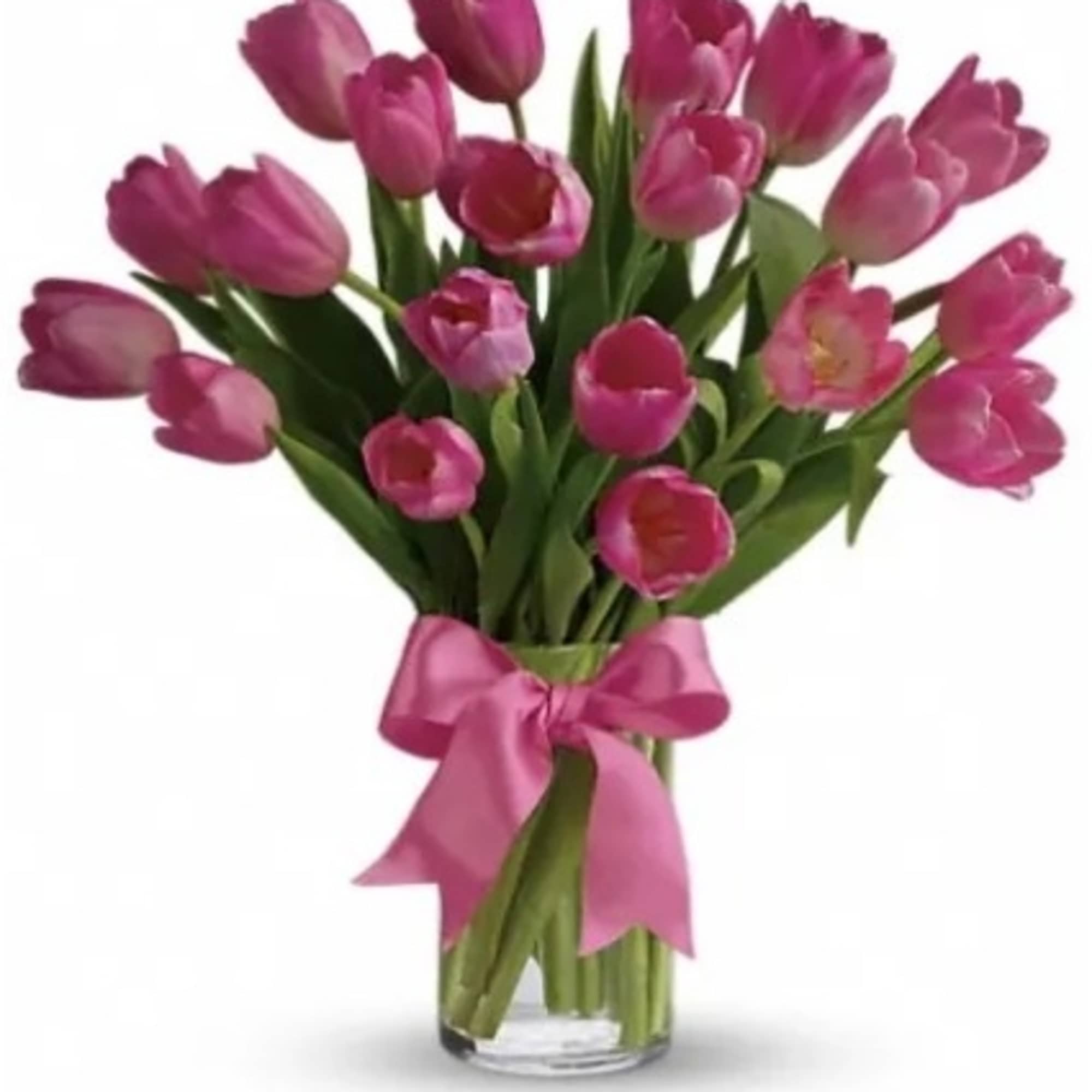 Tall arrangement of pink tulips in a clear glass vase with a pink ribbon bow