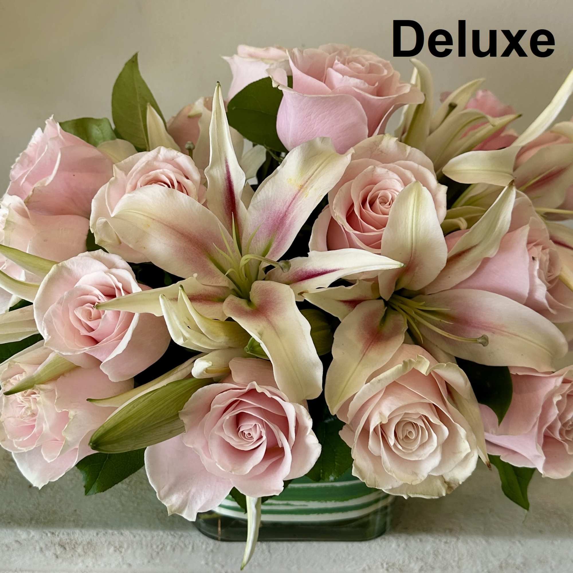White Lilies and 12 Pink Roses with greens arranged in a glass, photo 2 of 3