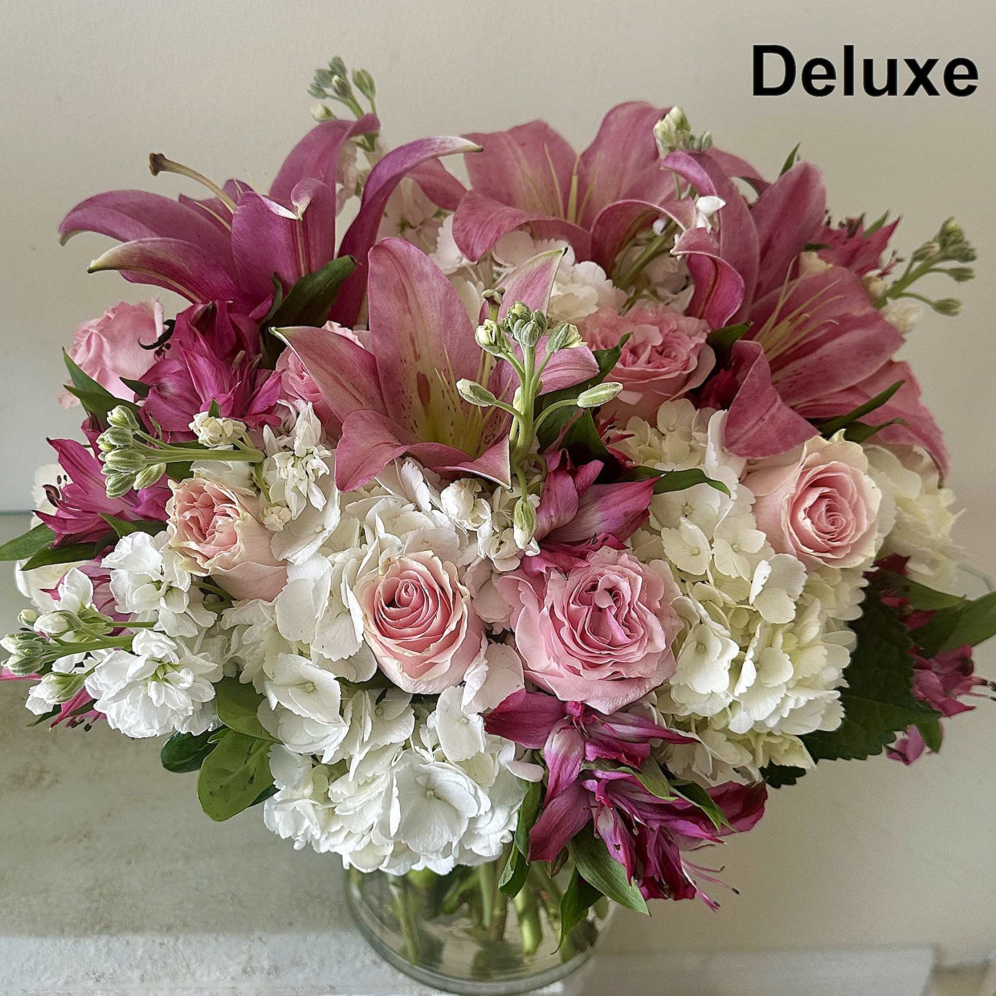 A lush and romantic mix of soft blush roses, white hydrangeas, star