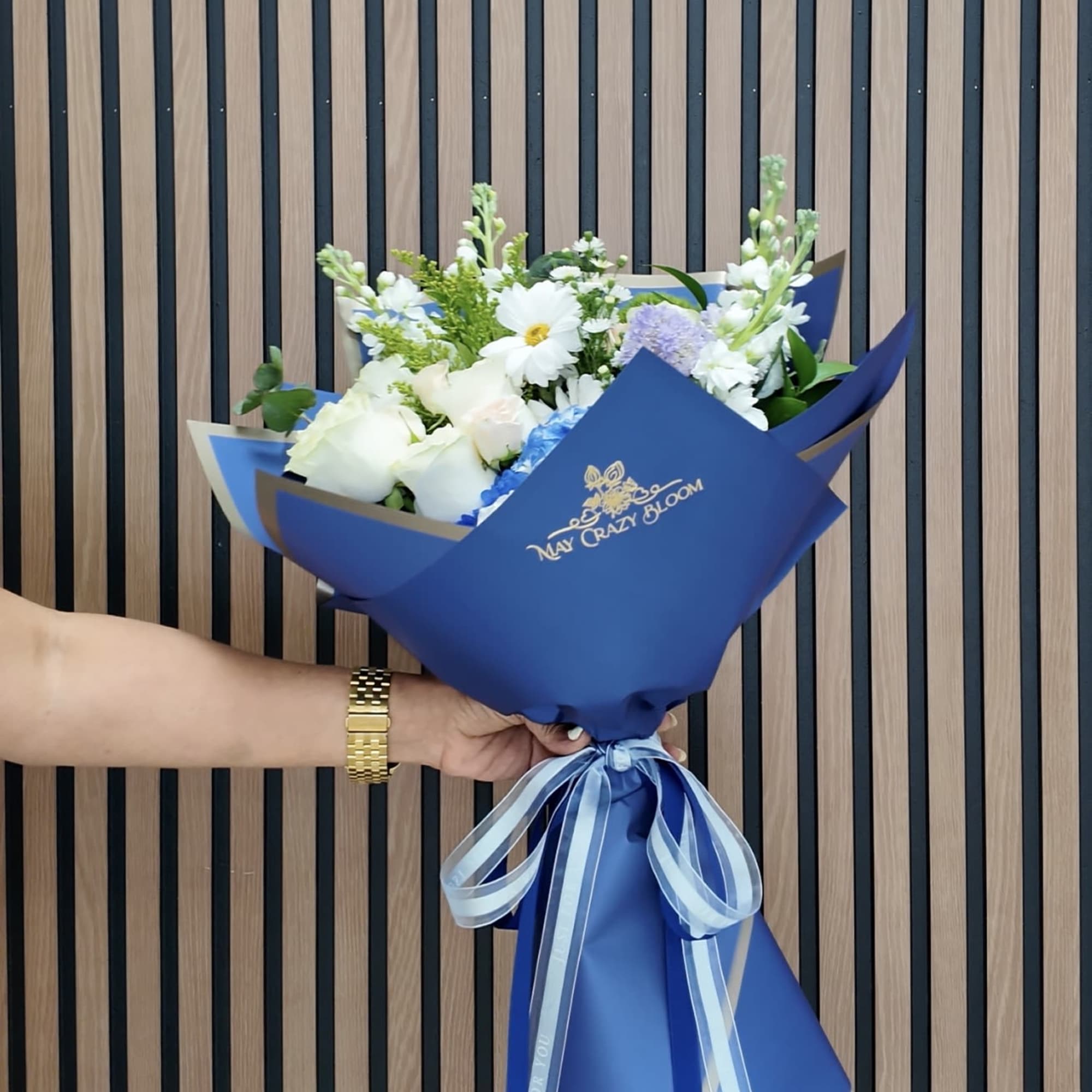 A striking cluster of blue hydrangea sets the tone for this blue-and-white, photo 2 of 2