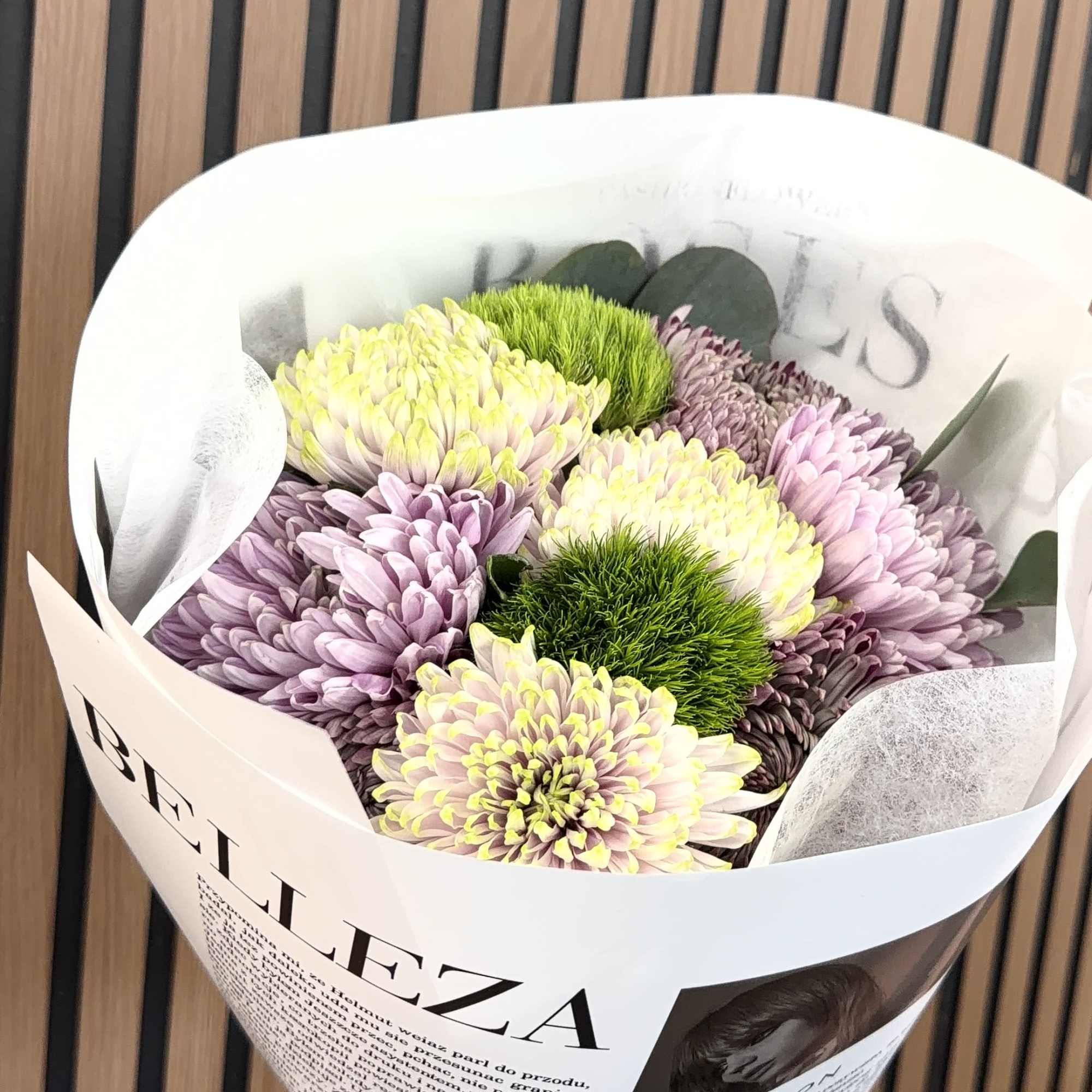 Soft lavender and creamy yellow-white chrysanthemums form a gently rounded bouquet that, photo 2 of 2