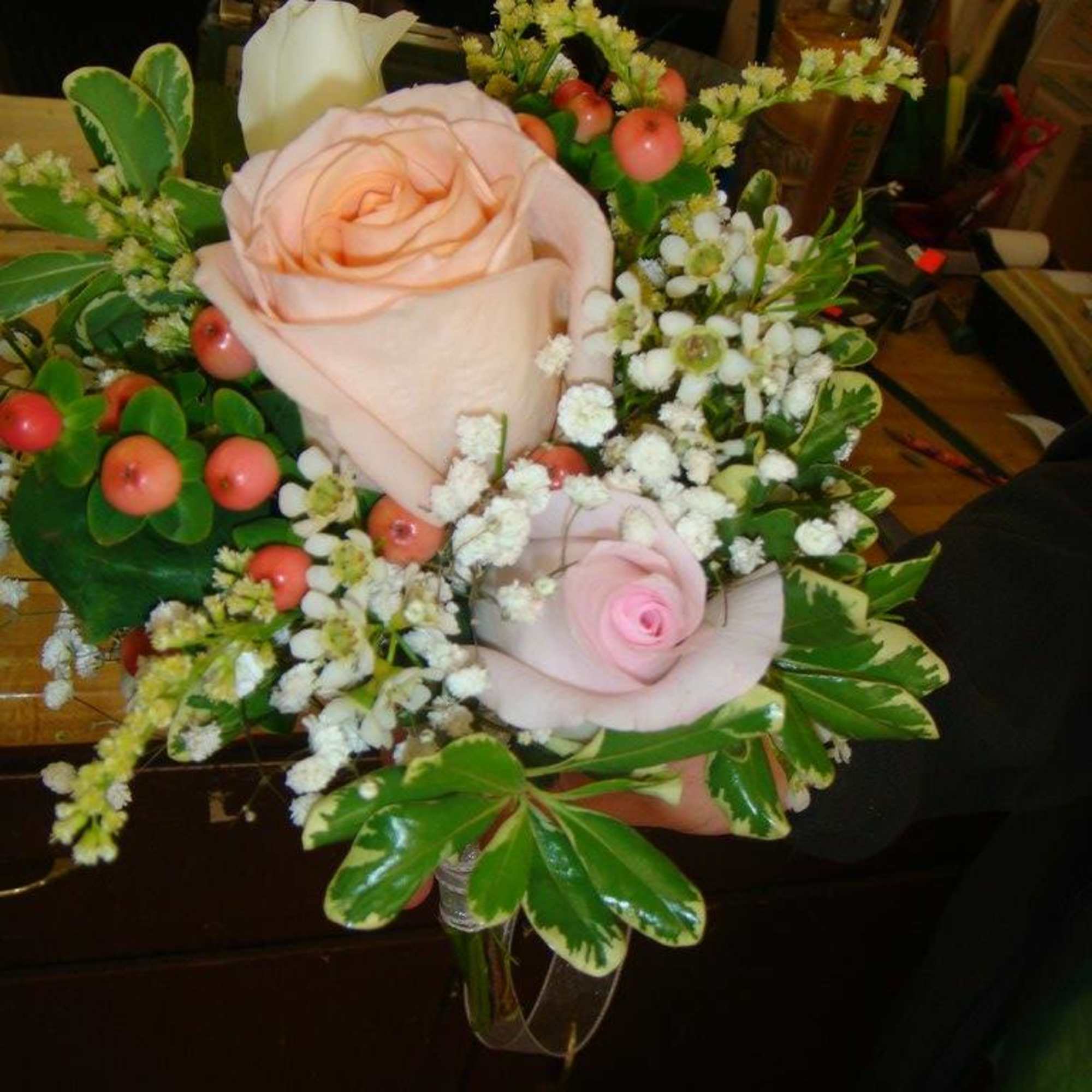 Bouquet of pale pink roses with white accent flowers