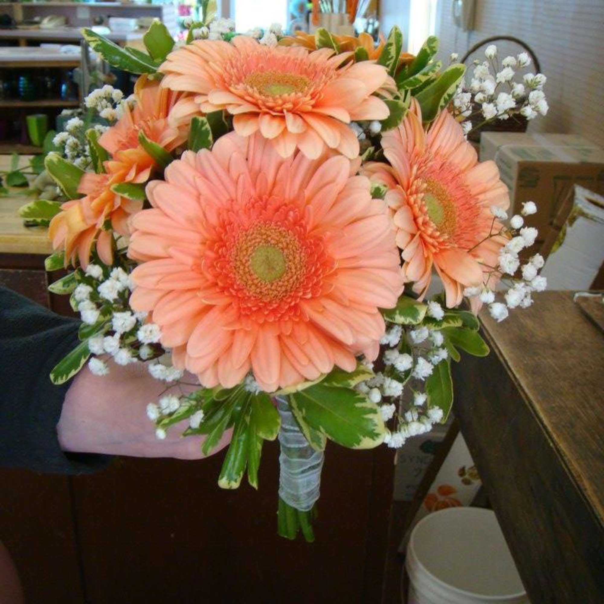 Peach gerbera daisy bouquet with baby's breath and greenery