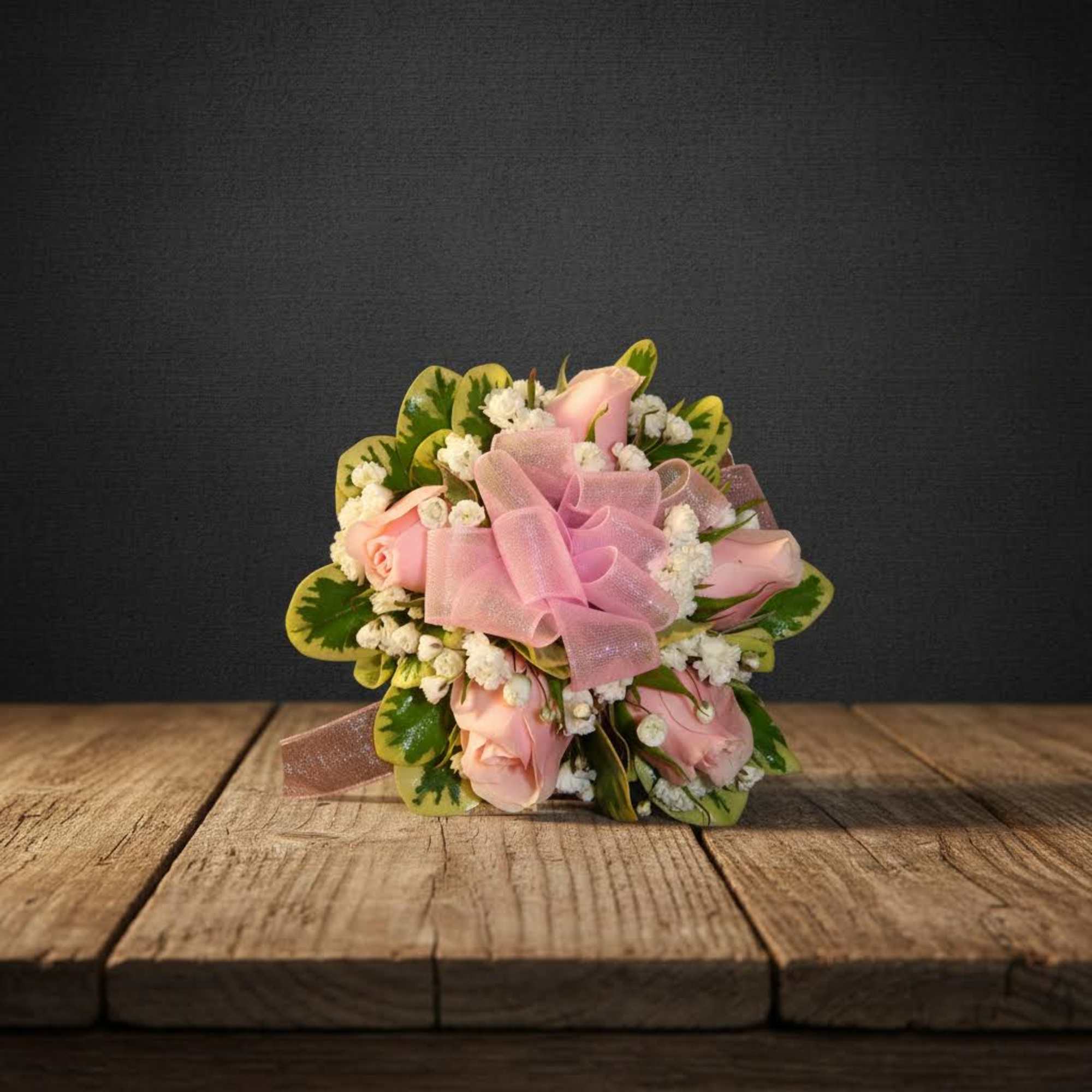 Pink rose bouquet with a sheer ribbon and white filler flowers