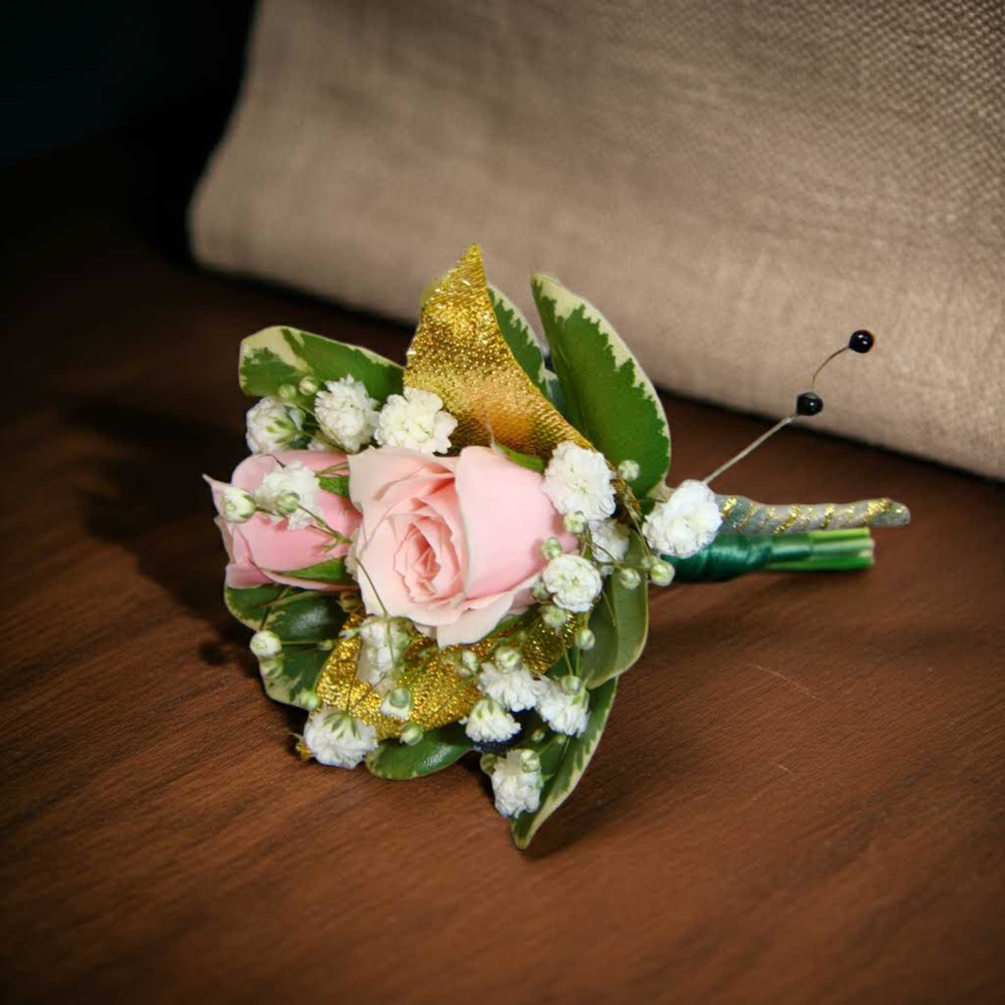 Boutonniere Pink spray Roses accented with gold leaves