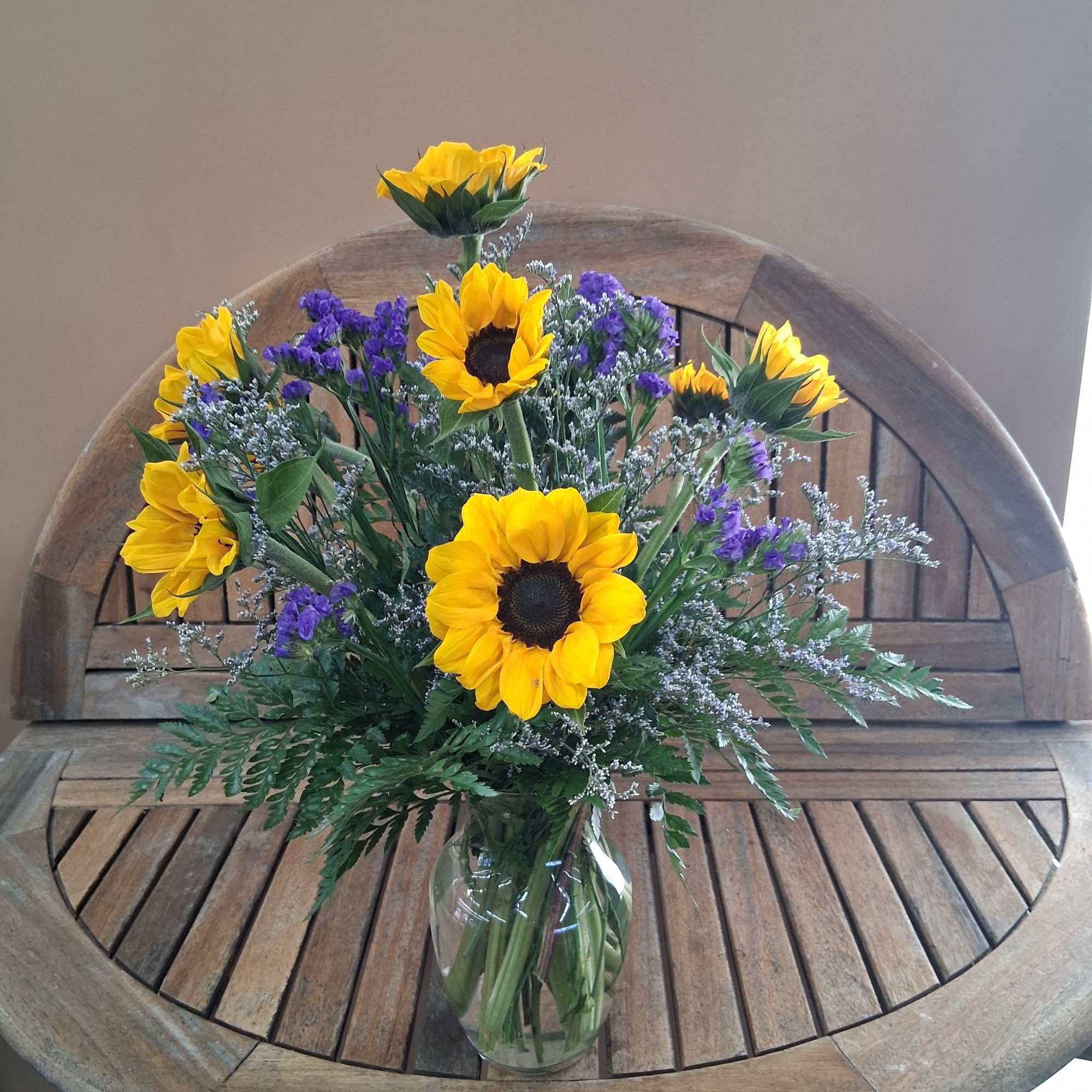 Golden sunflowers take center stage in this cheerful flower arrangement, brightening any, photo 3 of 3