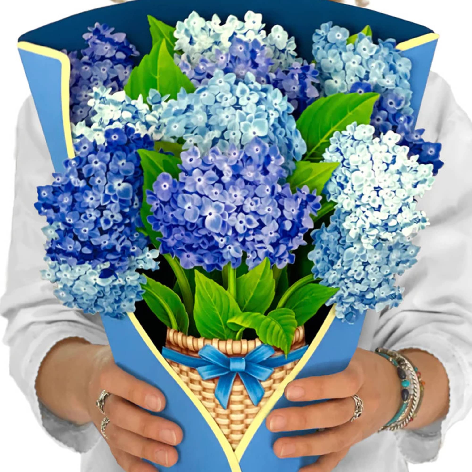 Bouquet of blue hydrangeas wrapped in blue paper with a ribbon