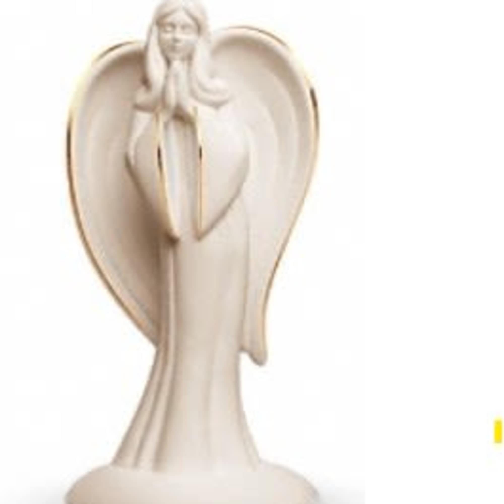 Beige angel figurine with large wings on a round base
