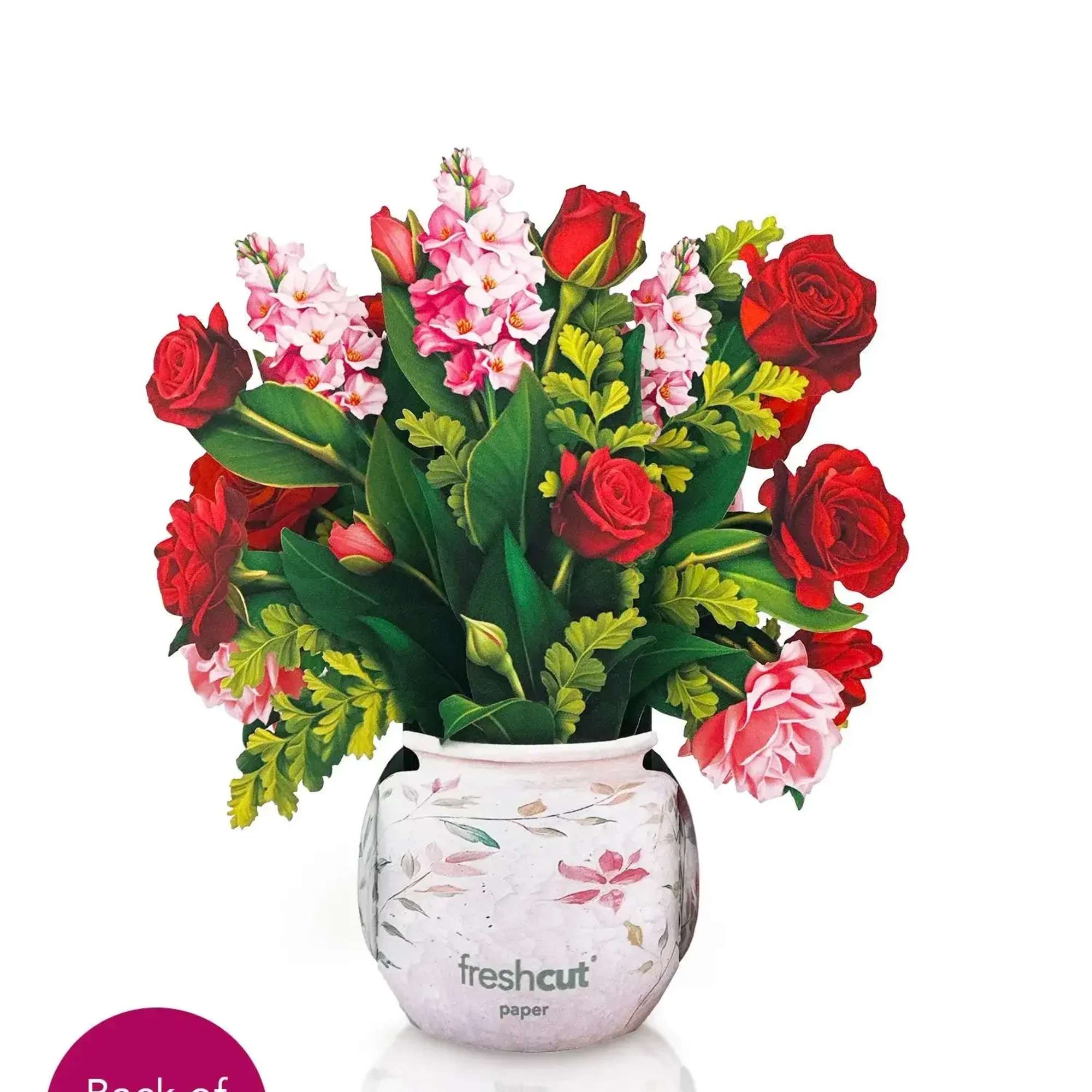 Red roses and pink flowers arranged in a decorative vase