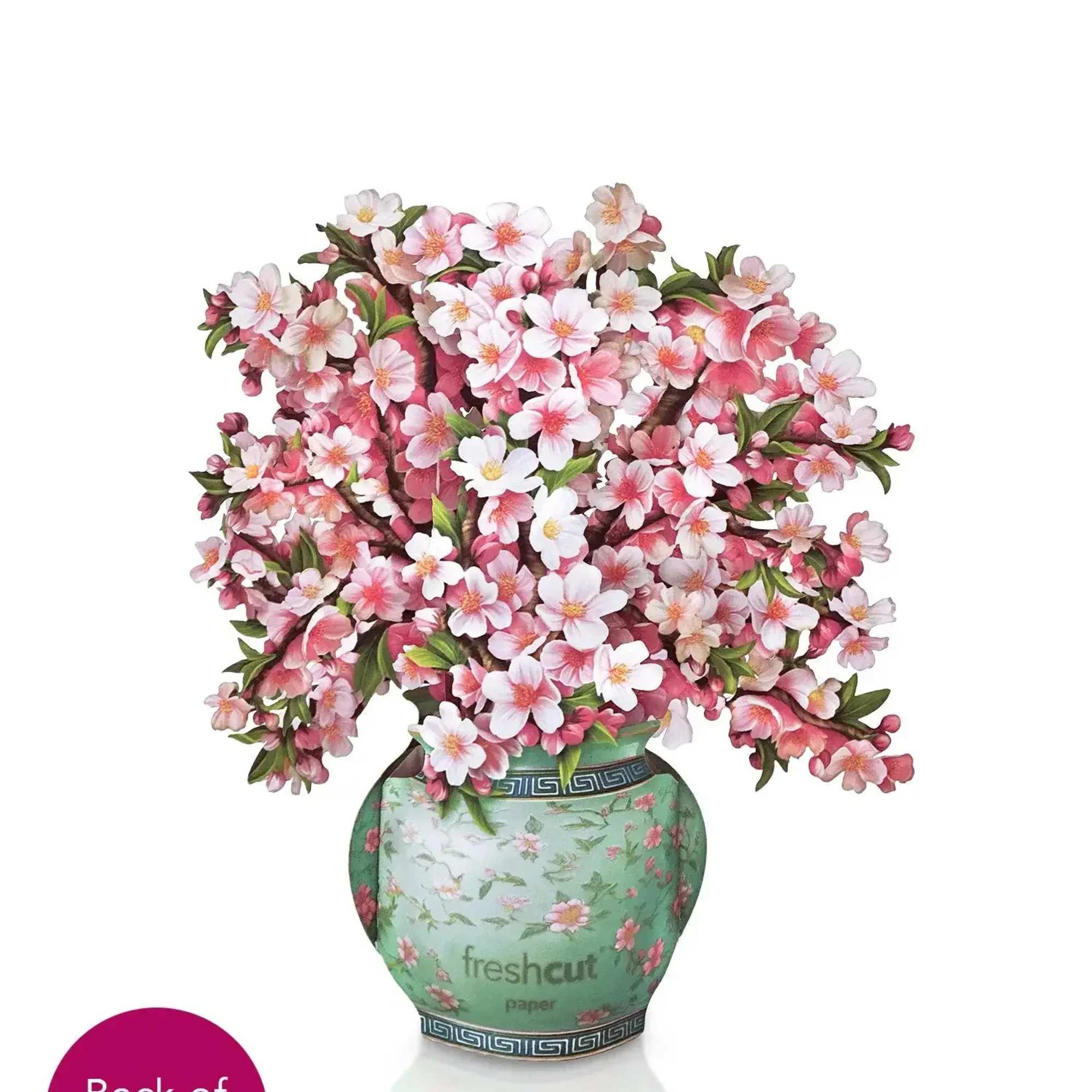 Pink cherry blossom arrangement in a decorative vase