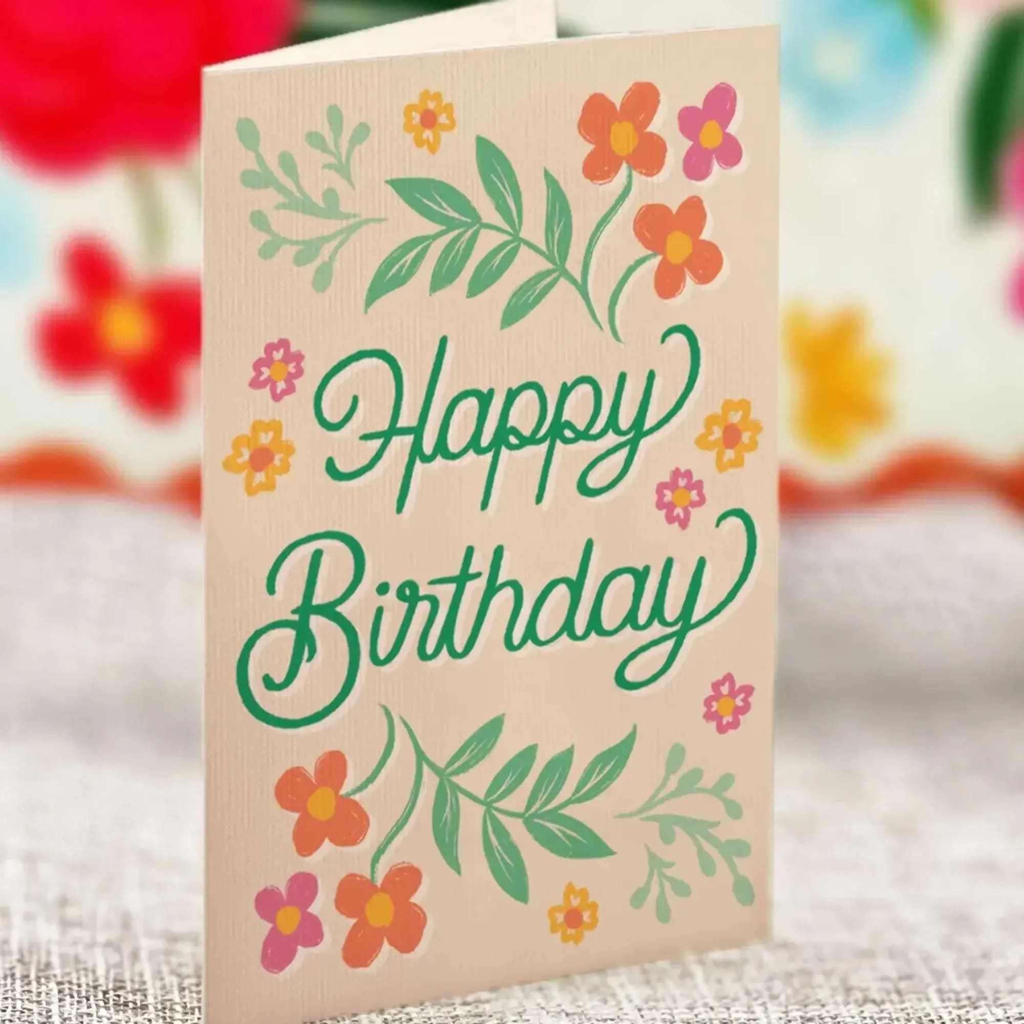 Birthday card with floral illustrations and green script text
