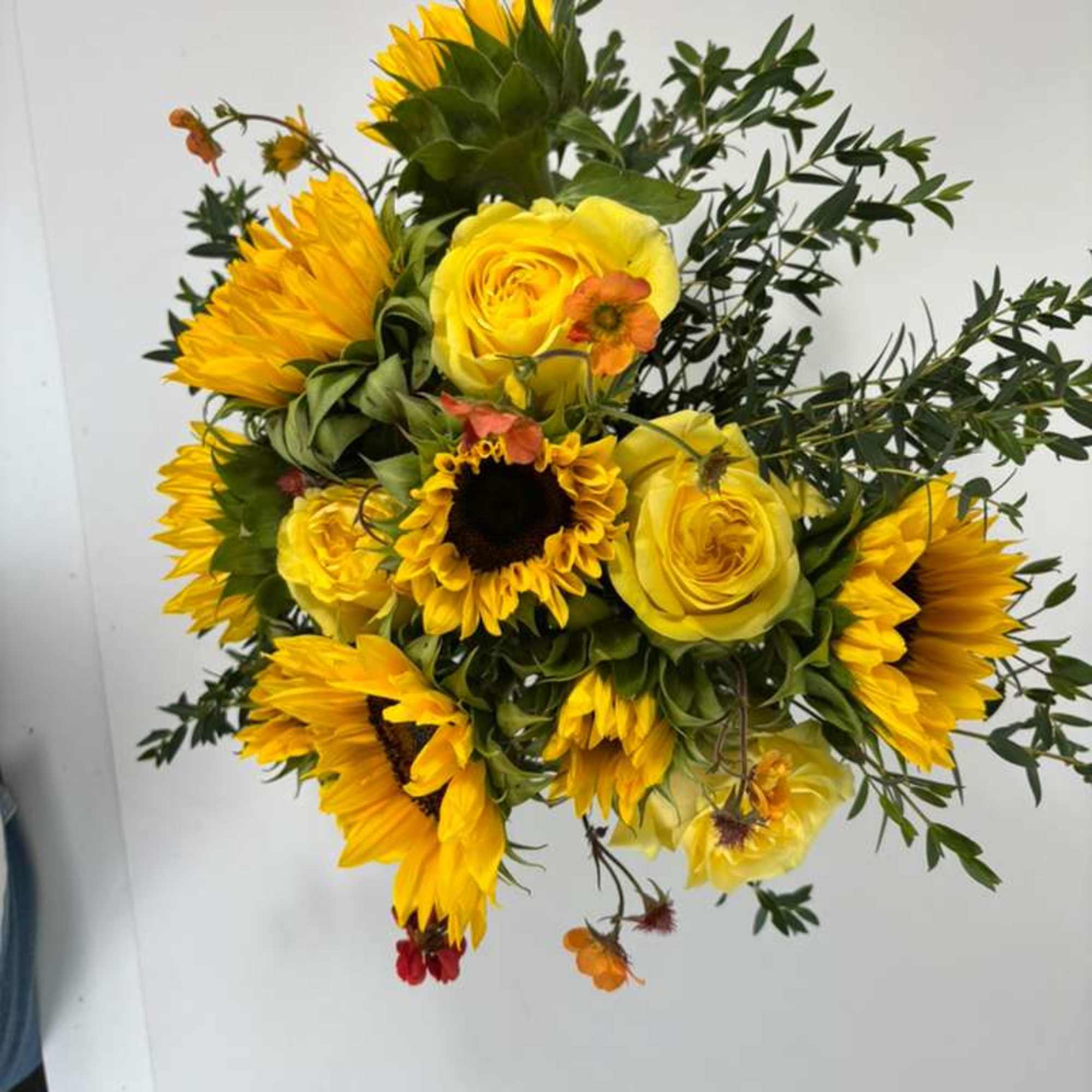 Yellow sunflower and rose bouquet with small orange accent flowers