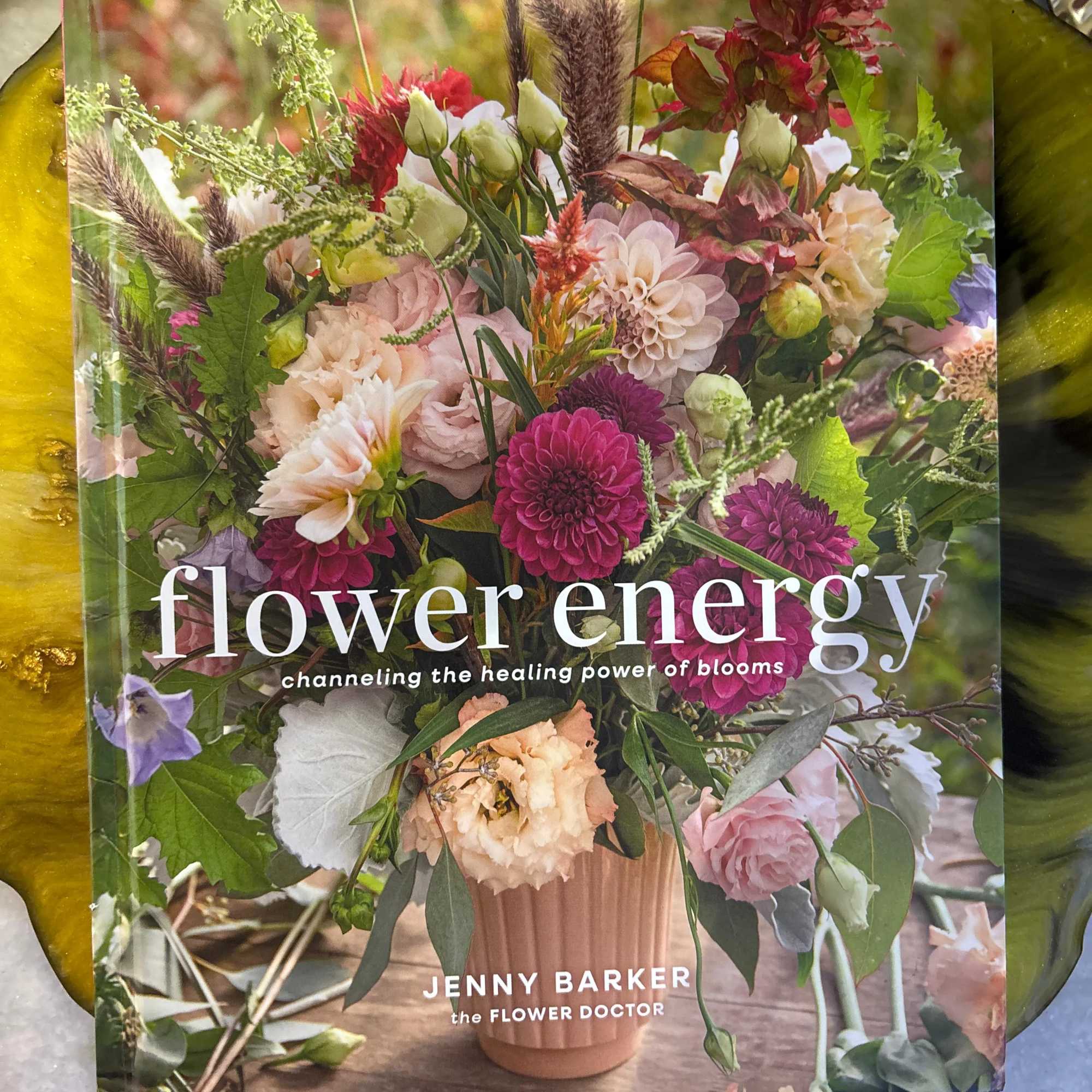 Book cover with a mixed floral arrangement in a vase