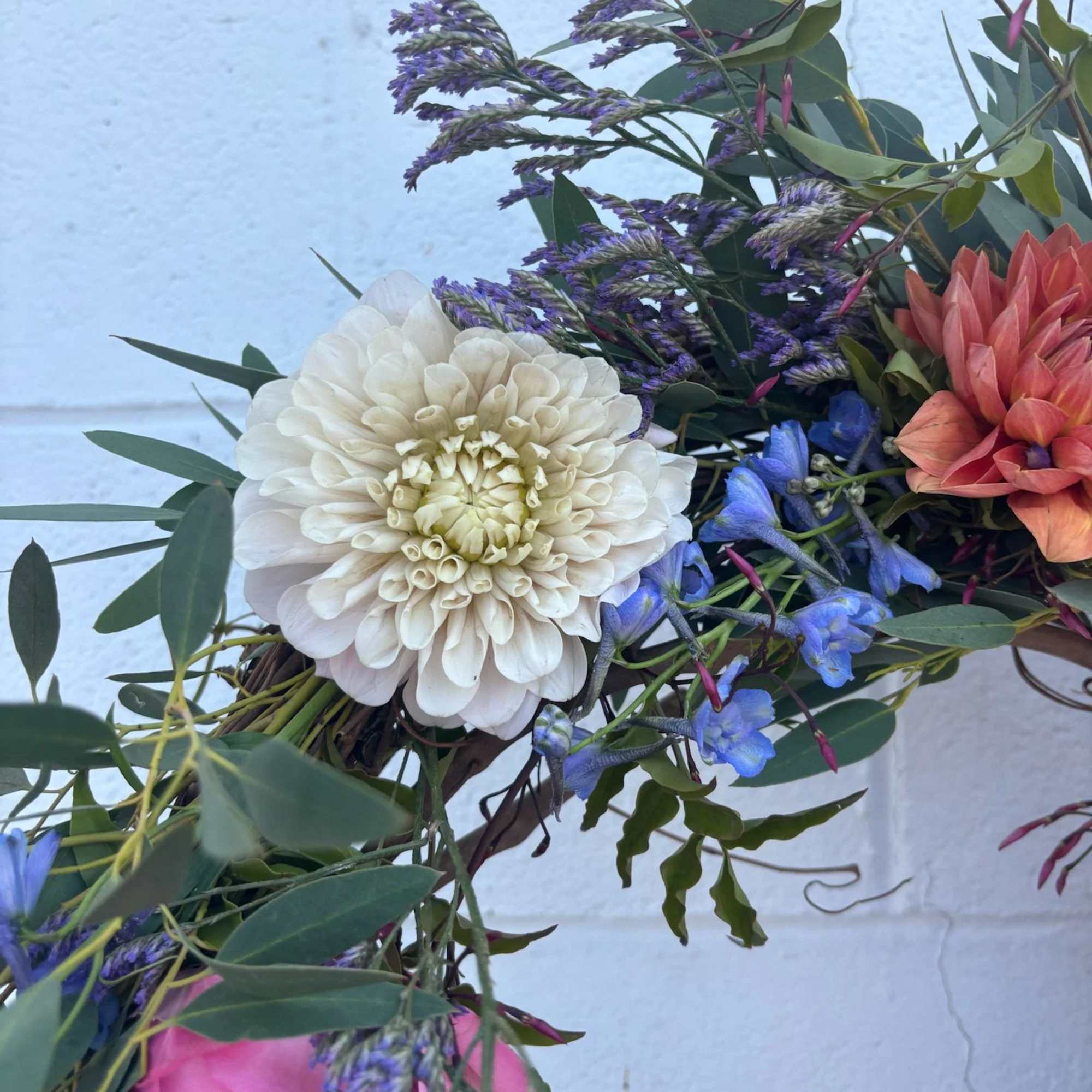 Mixed bouquet with white and pink blooms and blue-purple flowers