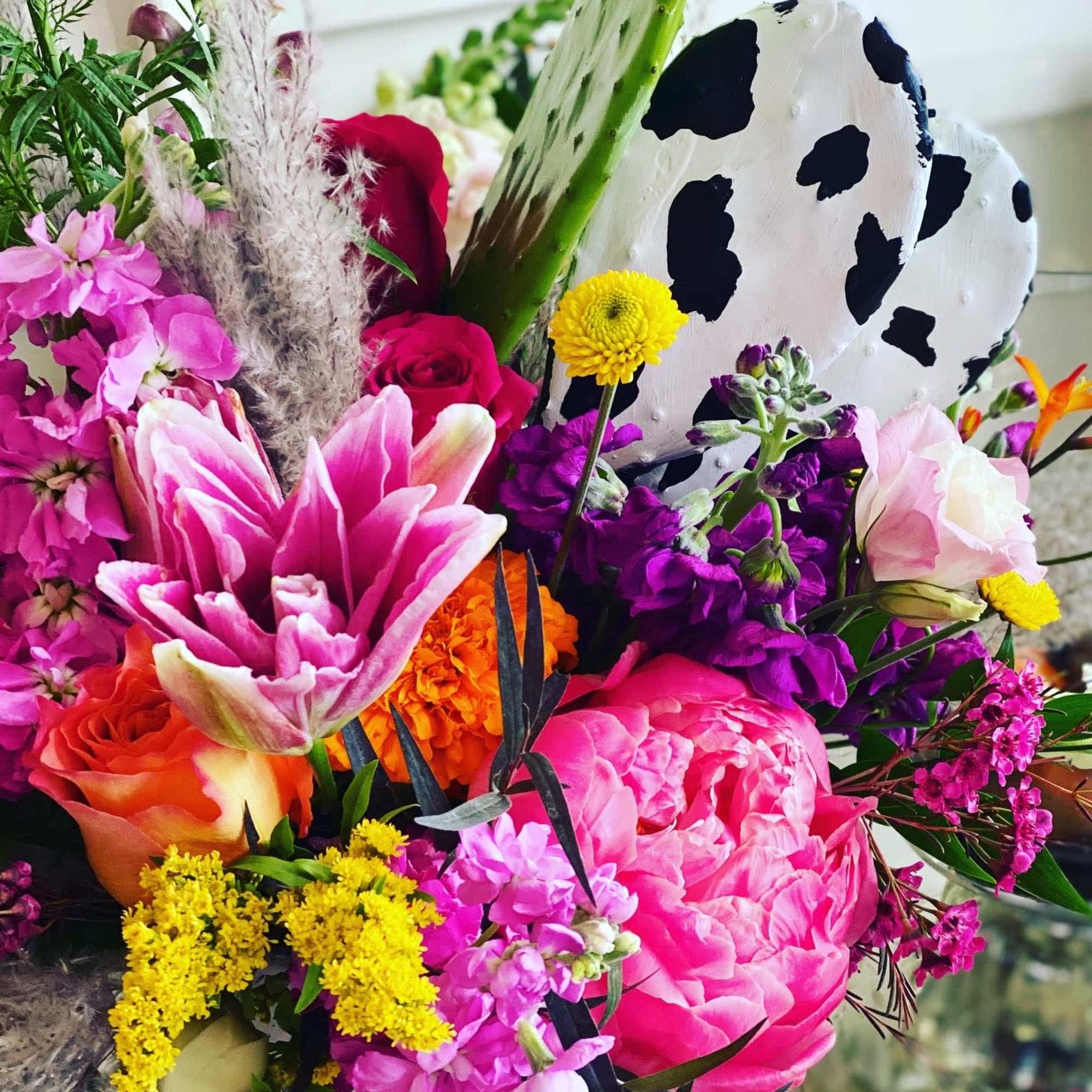 Bright mixed bouquet with pink, purple, orange, and yellow flowers