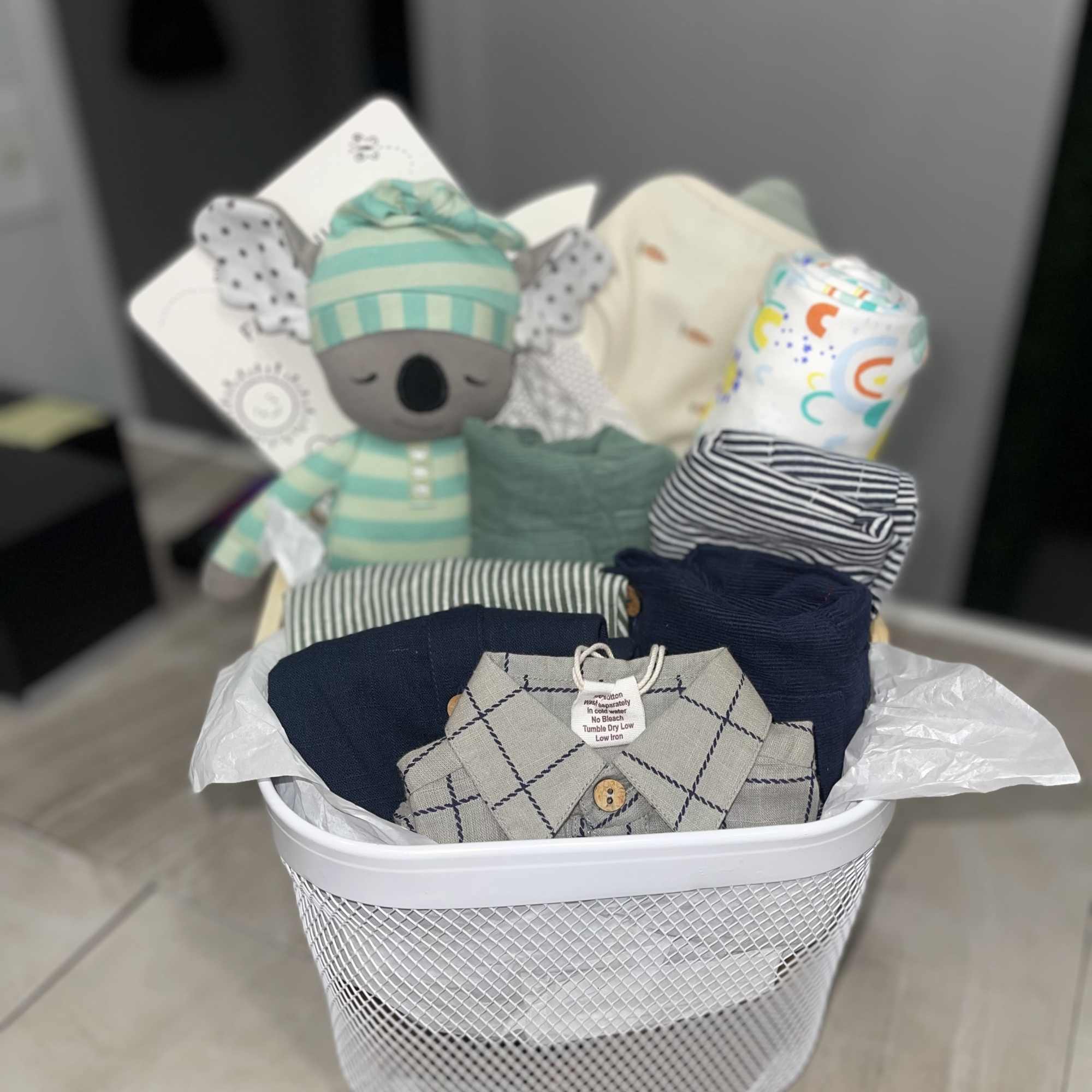 Soft neutrals washed with navy, mint and pastel accents make this baby