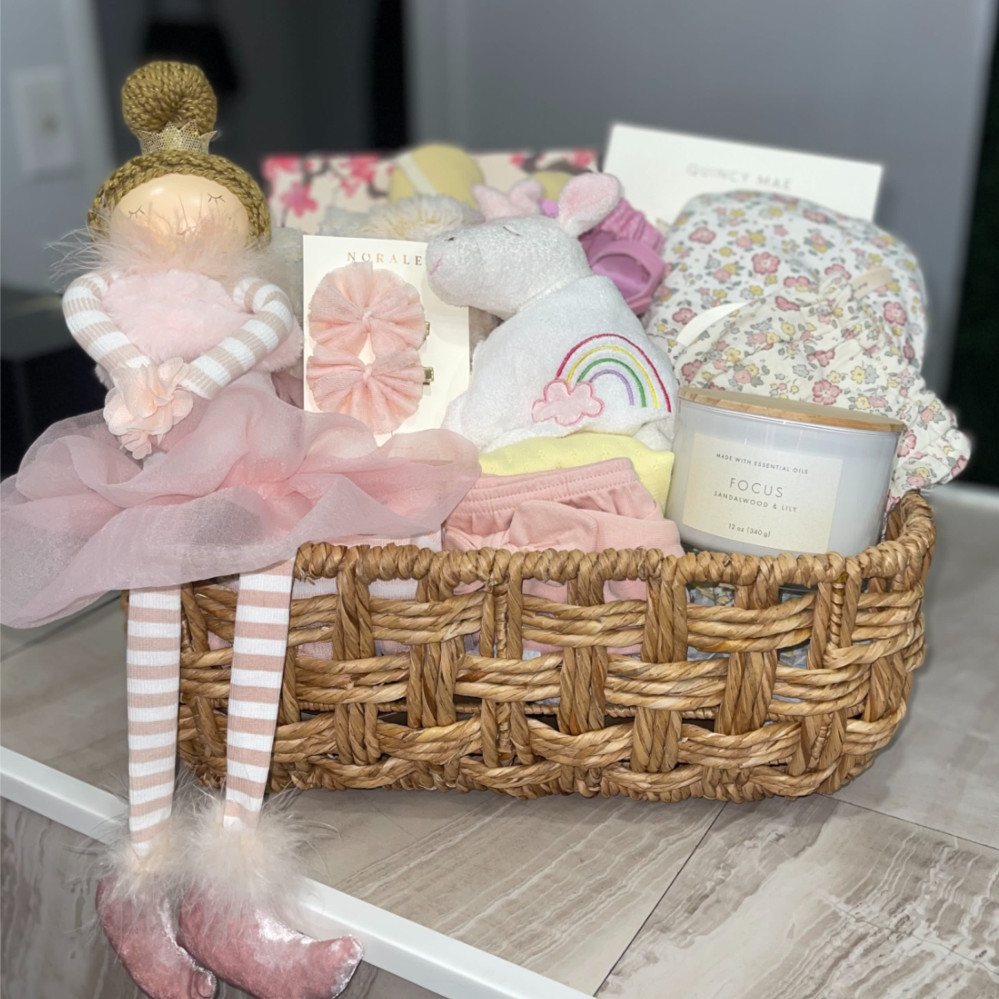 Soft pastels and cuddly textures make this Hello Baby Girl Basket the