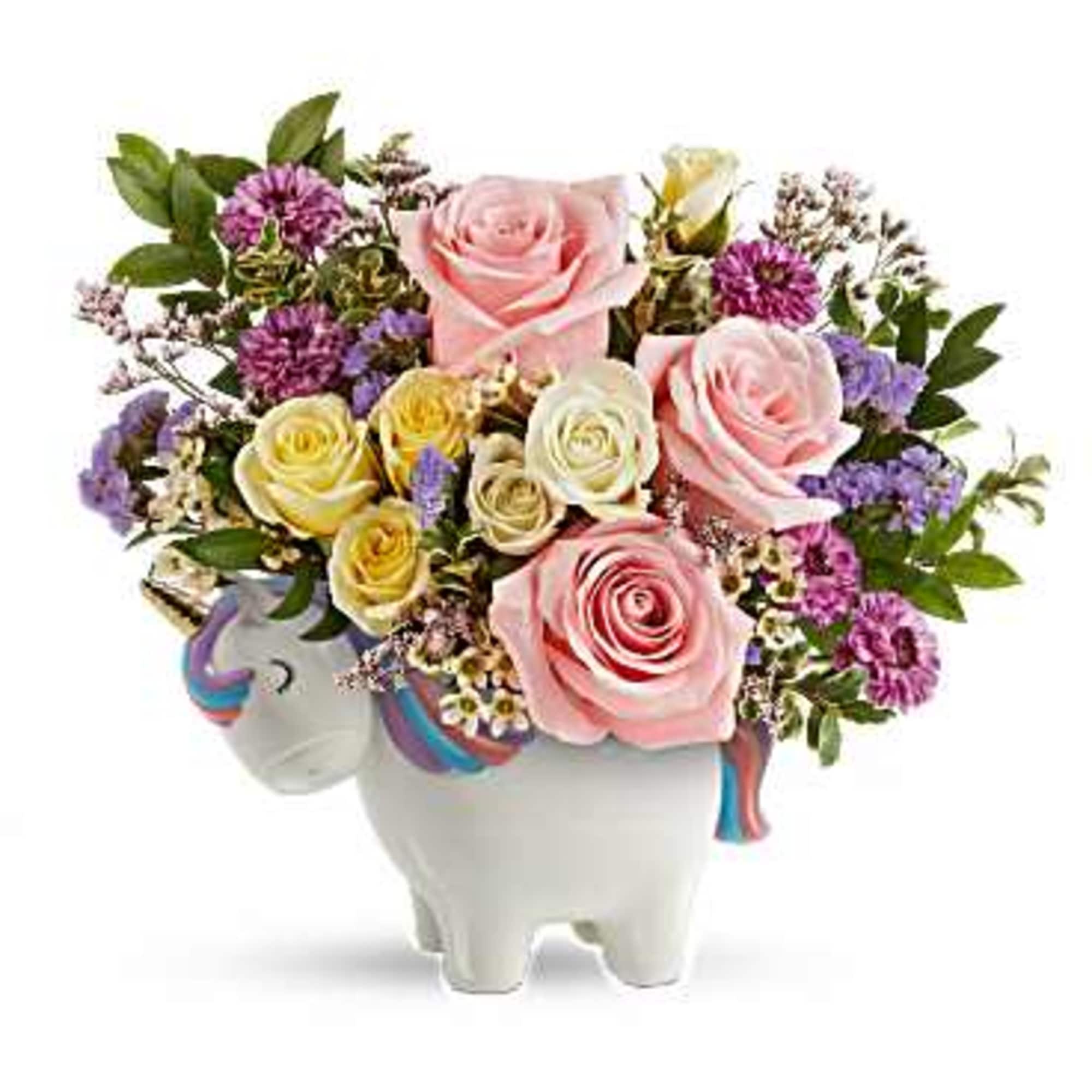 Bouquet of pink and yellow roses in a white unicorn vase