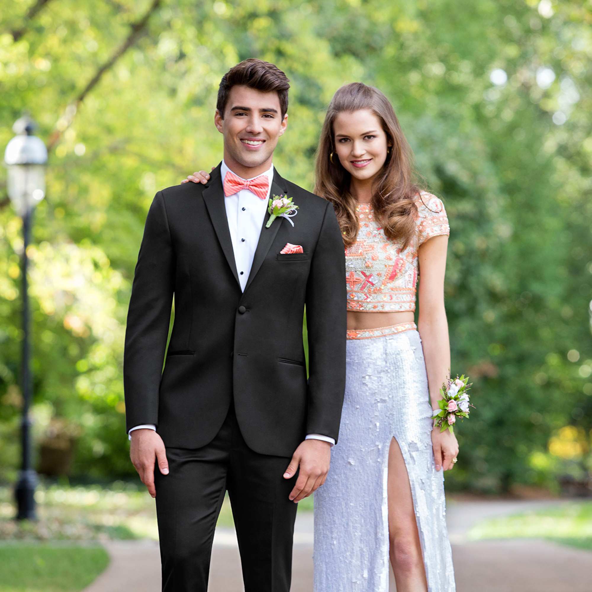 Young couple dressed for prom with a boutonniere and corsage