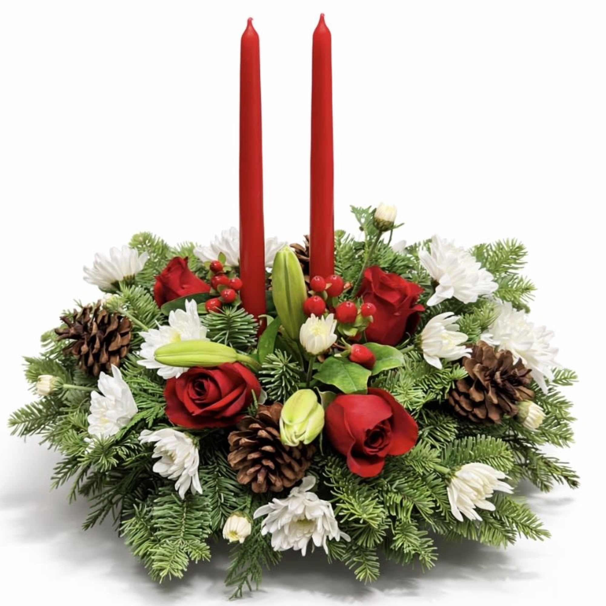 Holiday centerpiece with red candles, red roses, and white flowers