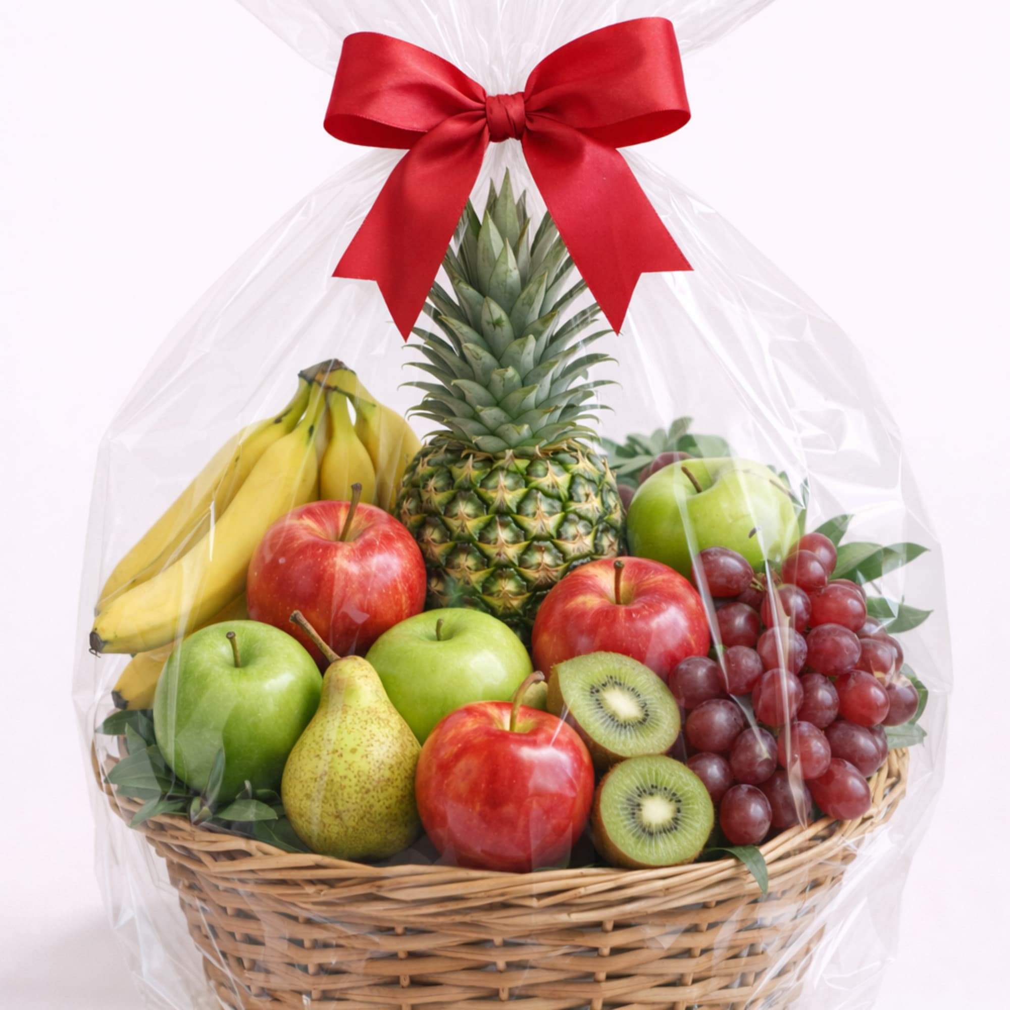 Fruit basket with bananas, apples, grapes, pineapple, pear, and kiwi wrapped in cellophane