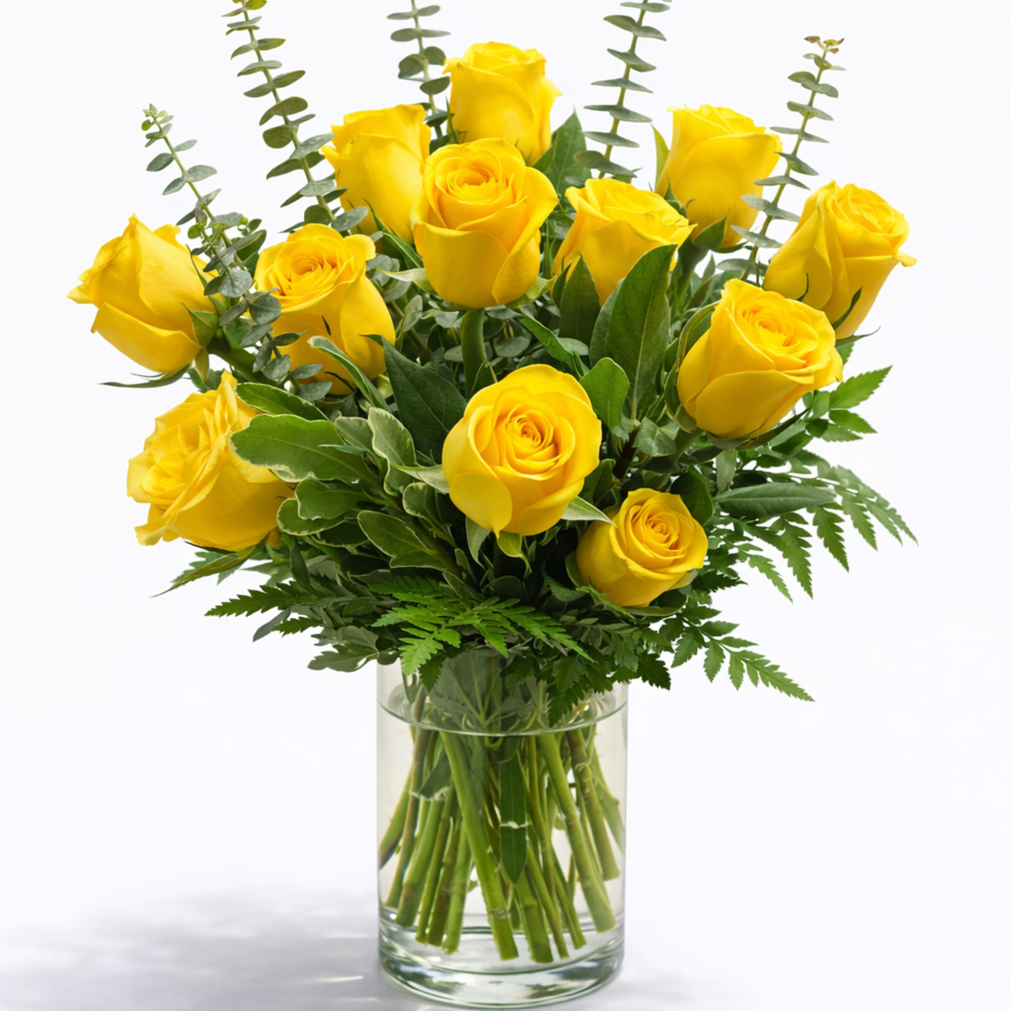 A radiant and elegant floral arrangement featuring vibrant yellow roses beautifully accented