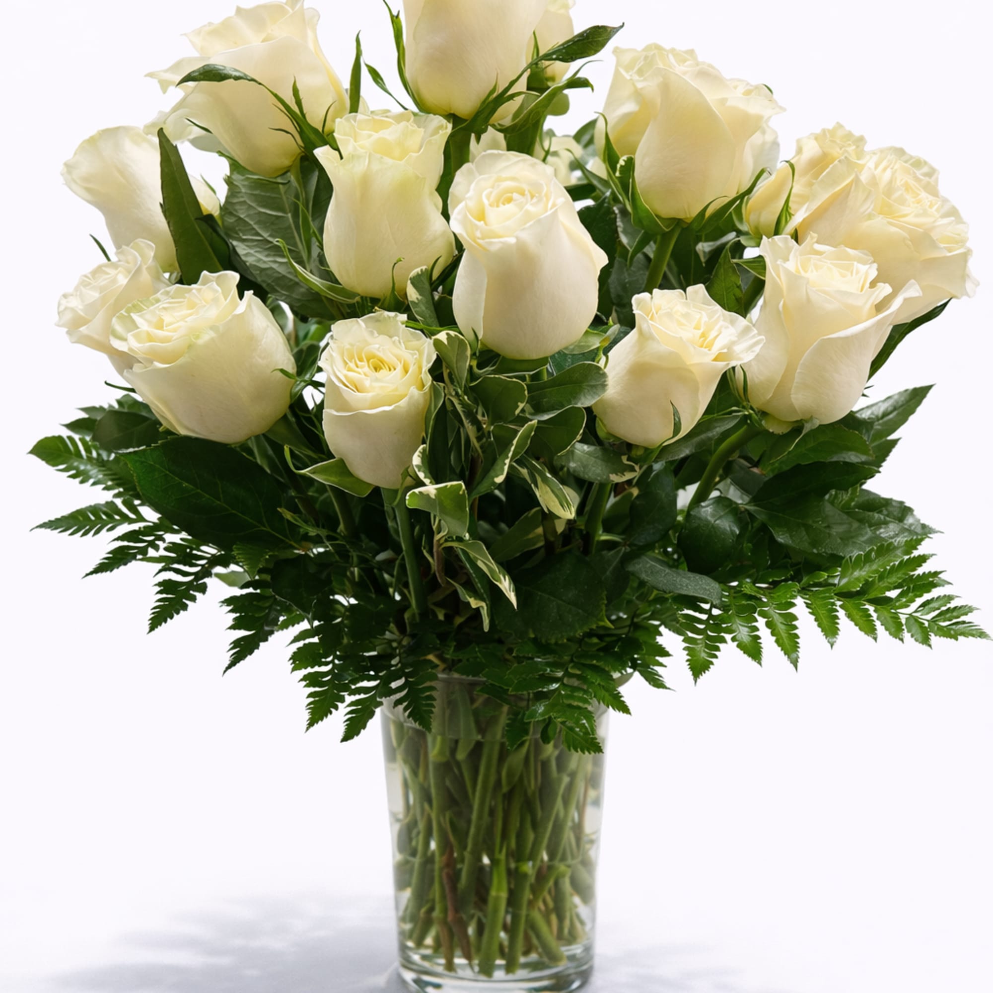 Bouquet of white roses in a clear glass vase