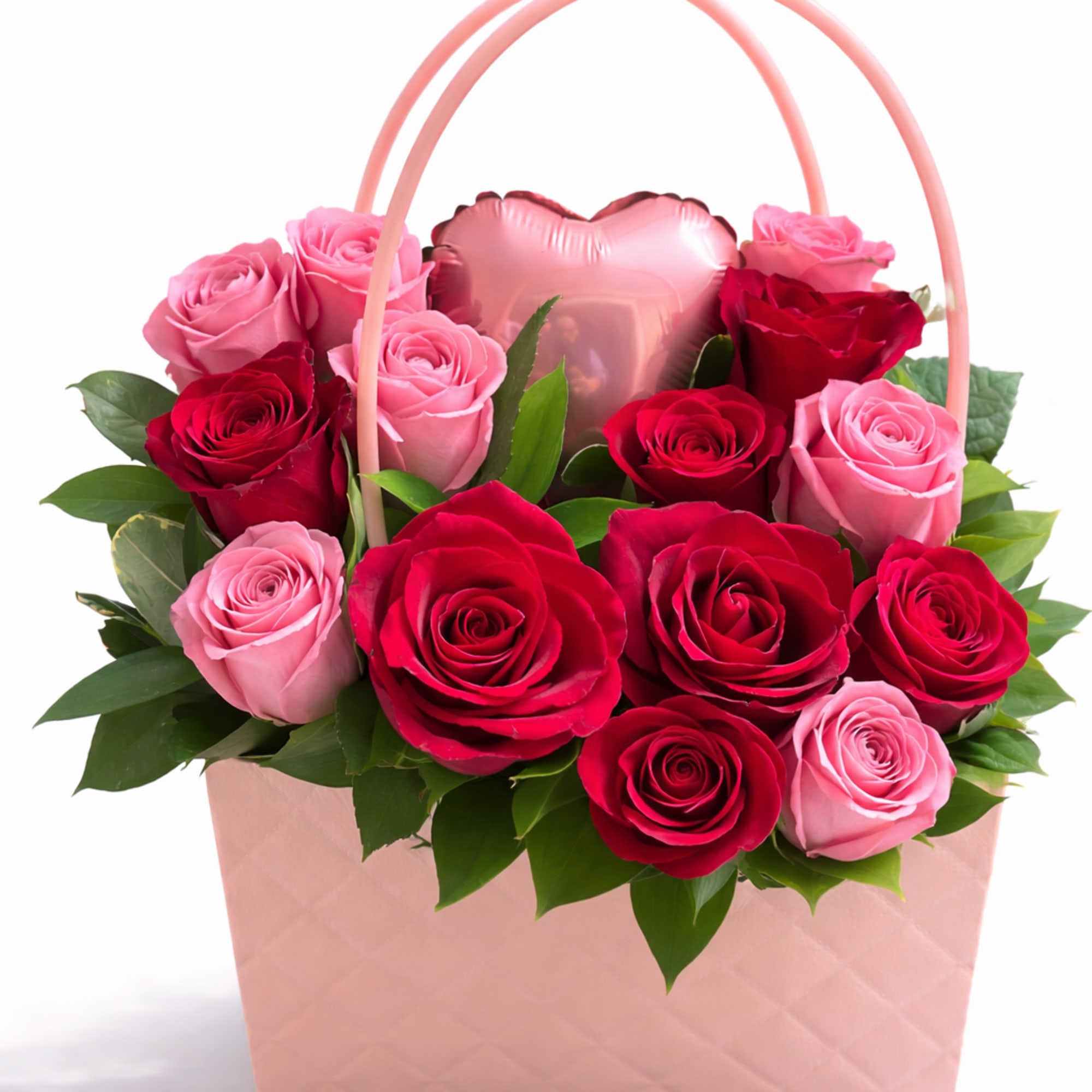 Pink and red roses arranged in a pink gift bag with a heart balloon