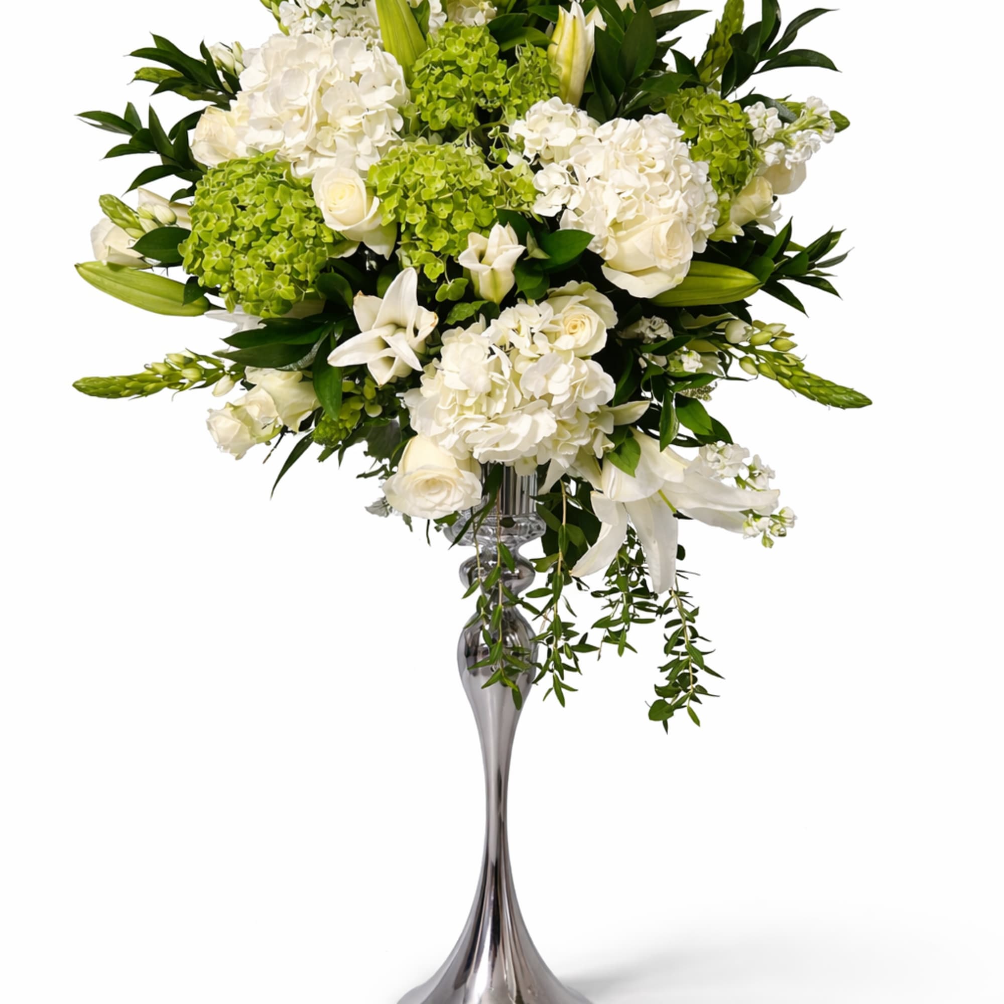 White floral arrangement in a tall silver vase