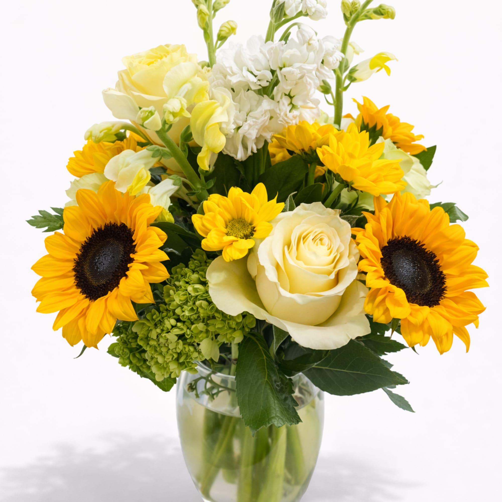 Bright, joyful, and full of life, this charming floral arrangement brings together