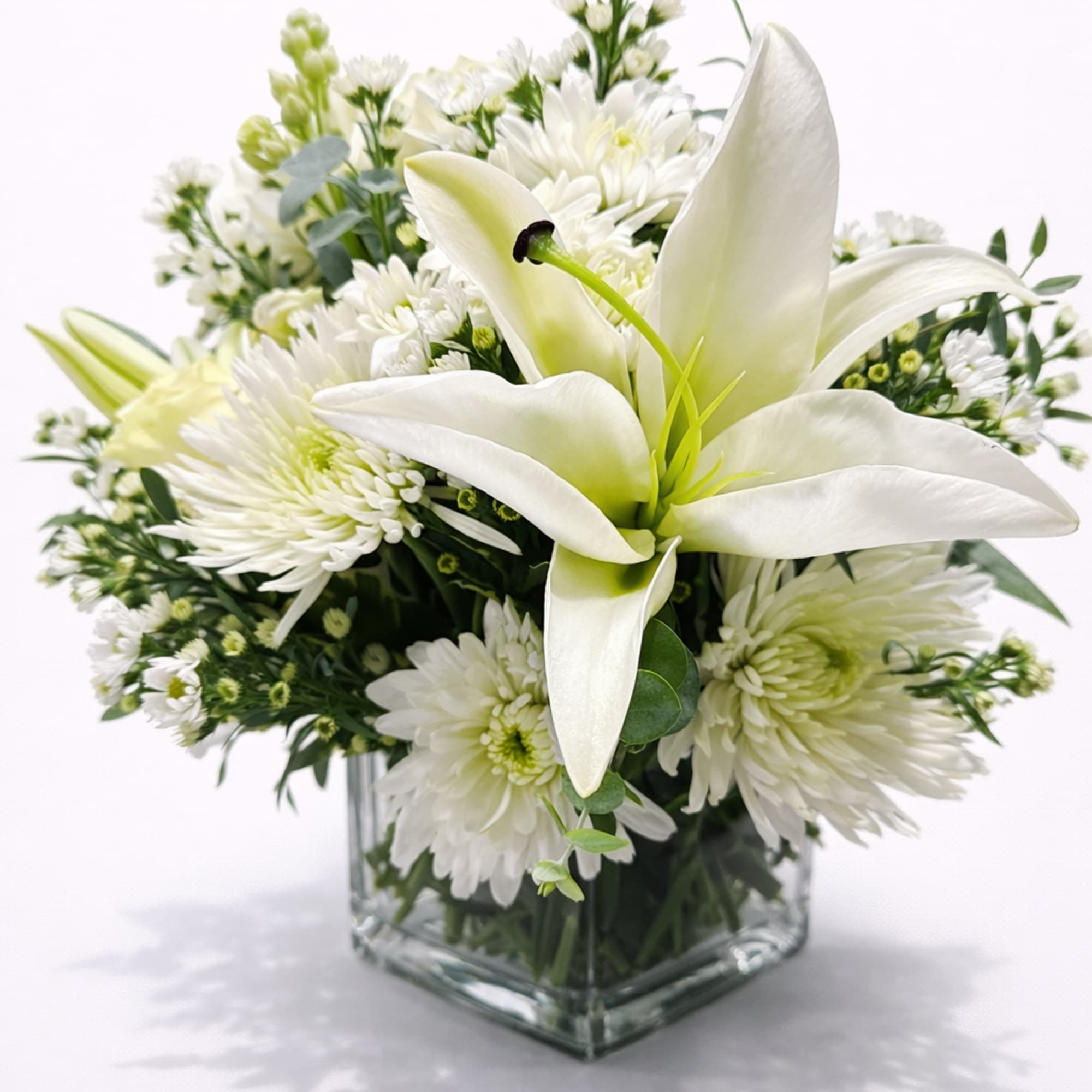 Soft, graceful, and effortlessly elegant, this refined arrangement features a stunning white