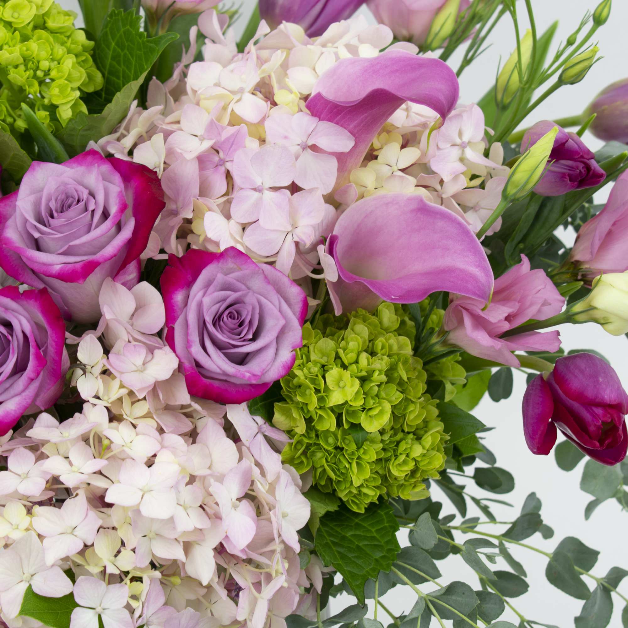 Bouquet of pink roses, hydrangeas, and calla lilies
