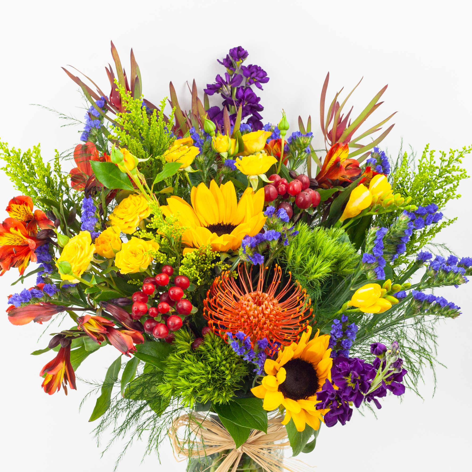 Bright mixed bouquet with sunflowers, orange blooms, and purple flowers