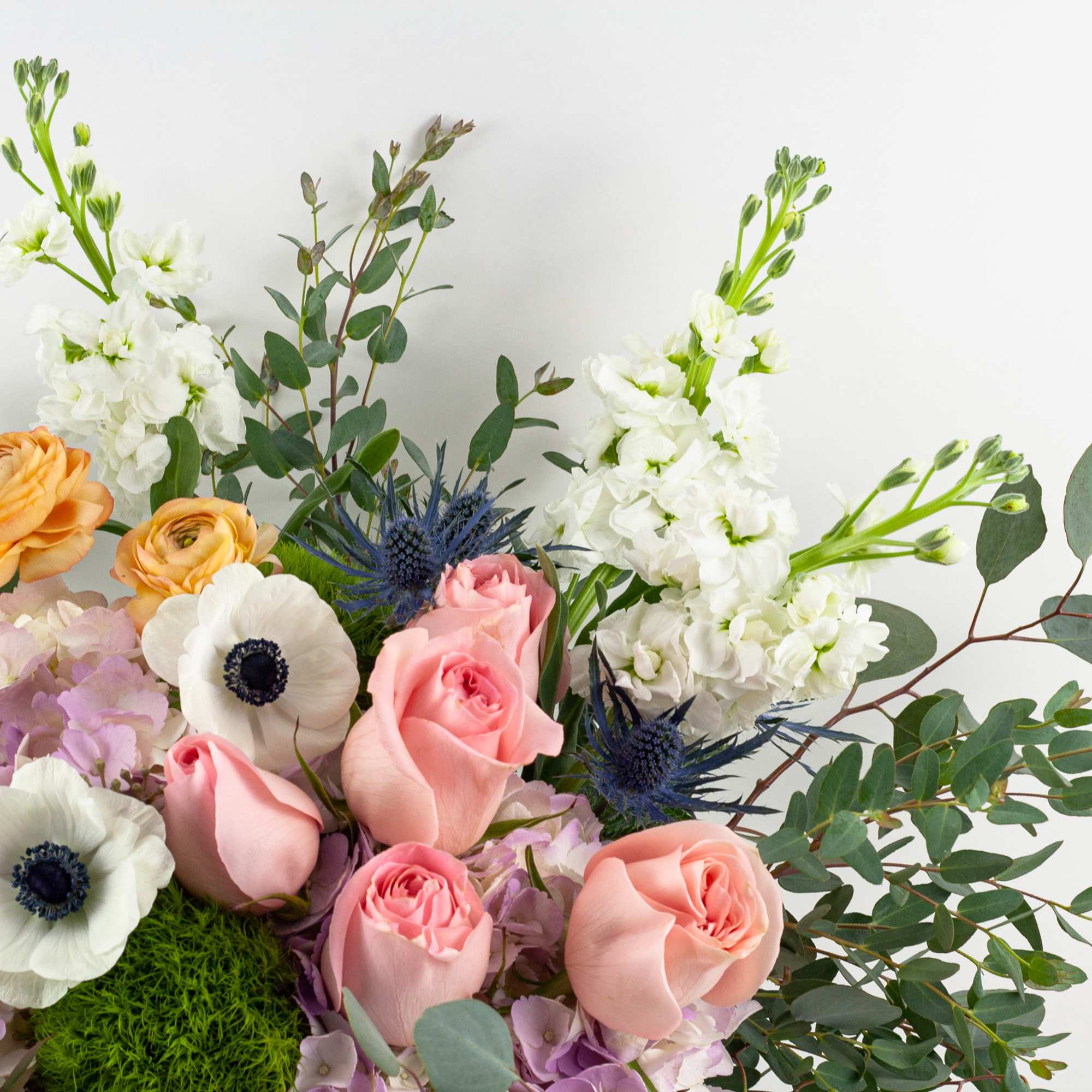 Mixed bouquet with pink roses, white anemones, and orange ranunculus, photo 4 of 4