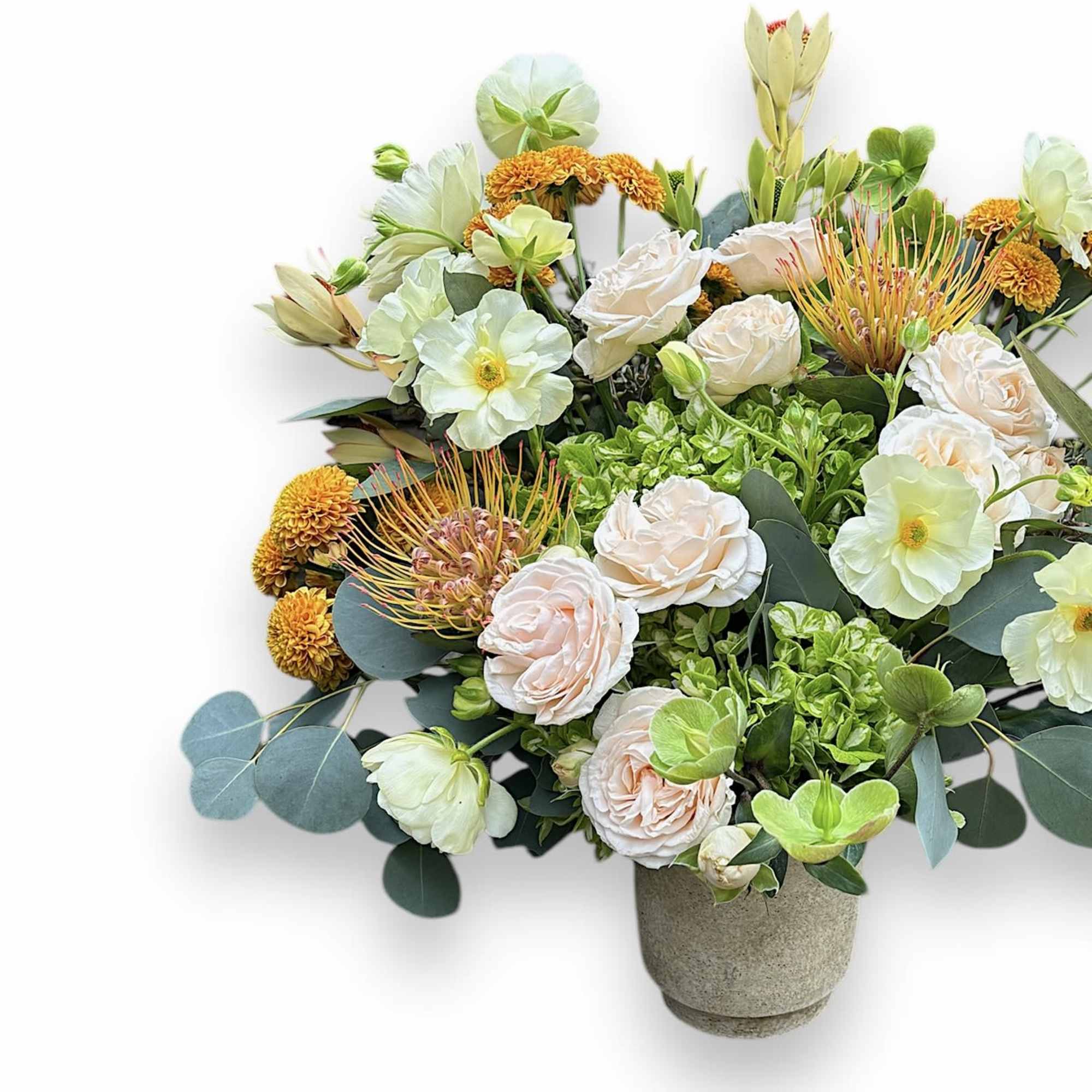 Mixed bouquet in a stone vase with pale roses and green-white blooms