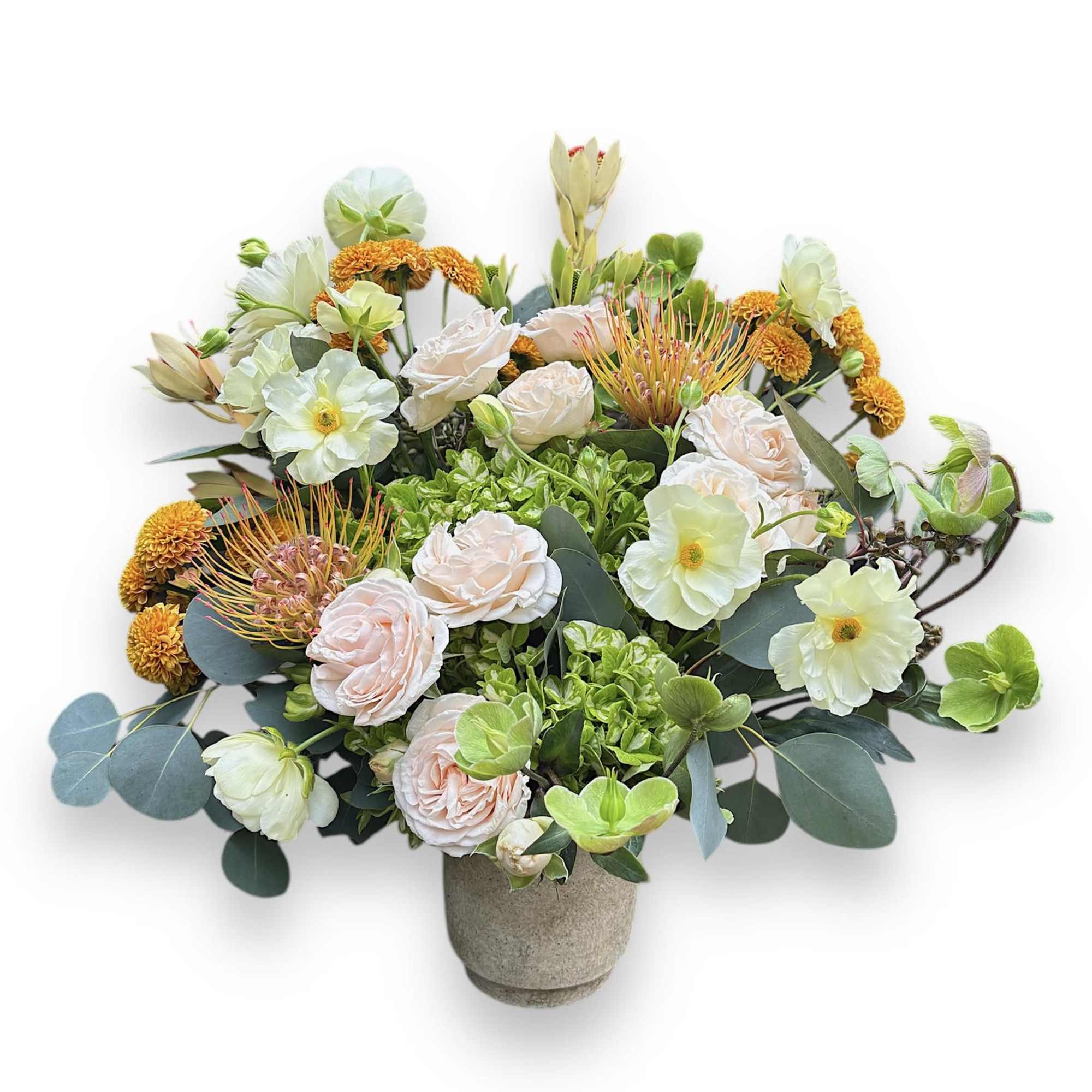 Mixed bouquet in a stone vase with pale roses and white blooms