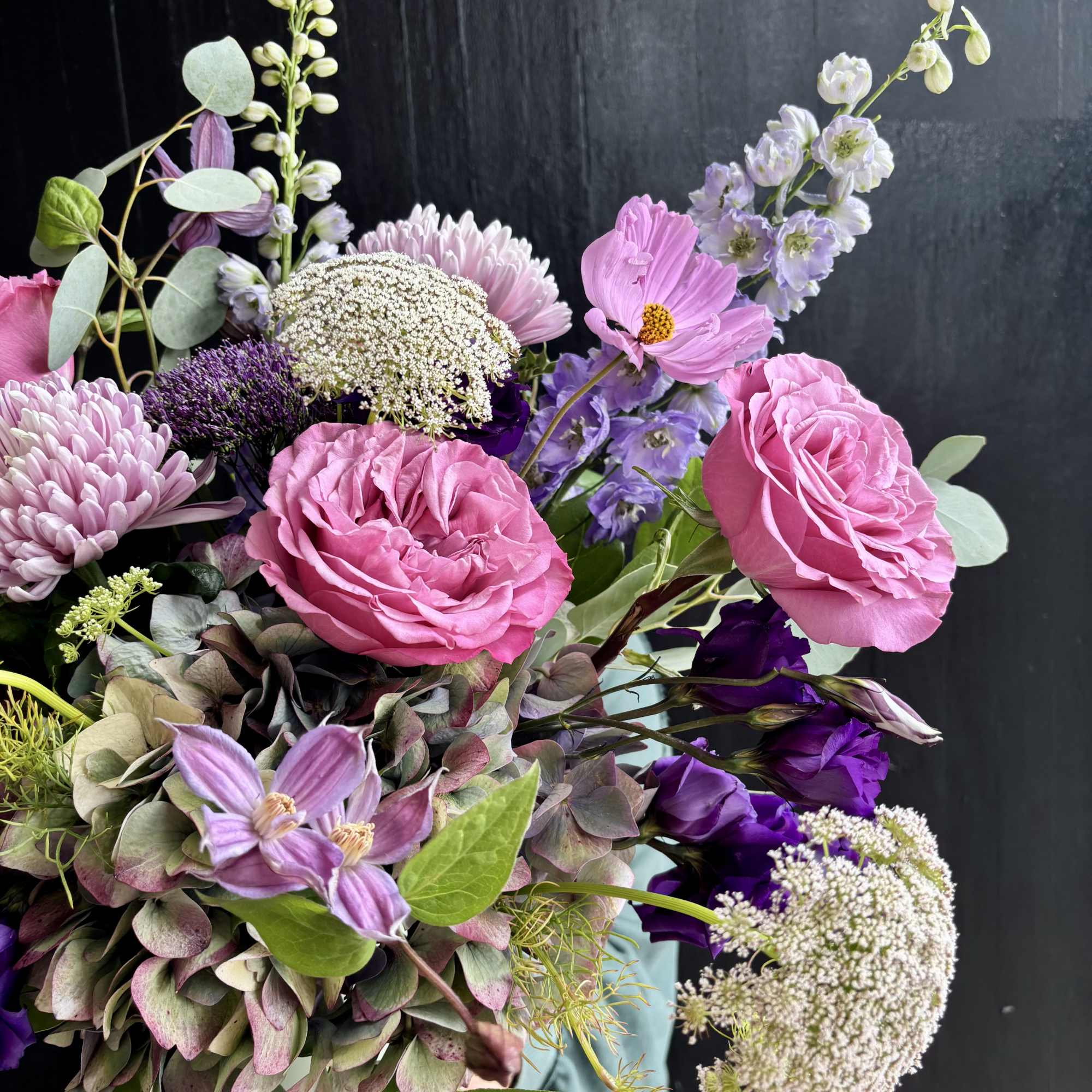Pink and purple mixed bouquet with roses, chrysanthemums, and airy filler flowers