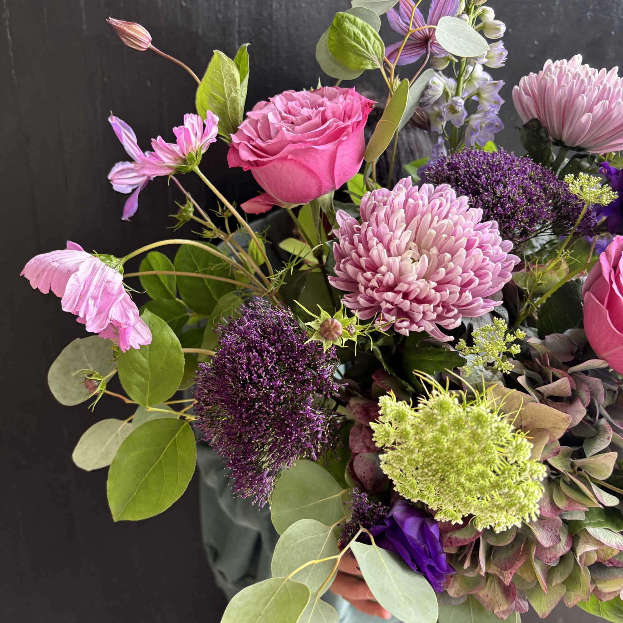 Pink rose and chrysanthemum bouquet with purple accents