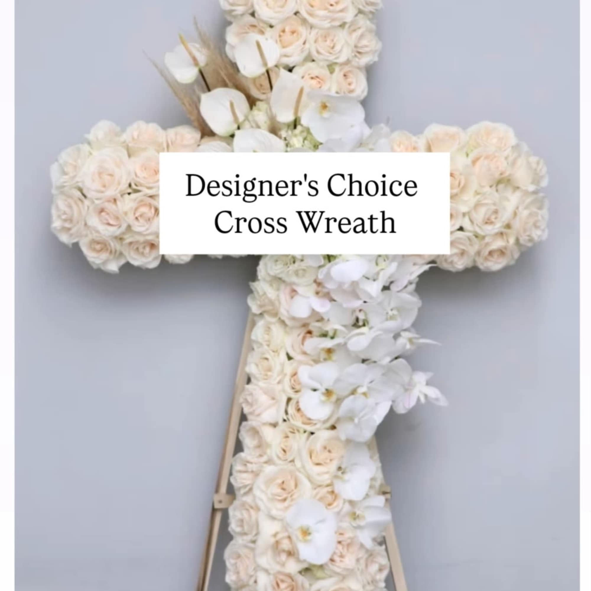 Floral cross wreath with cream roses and white orchids