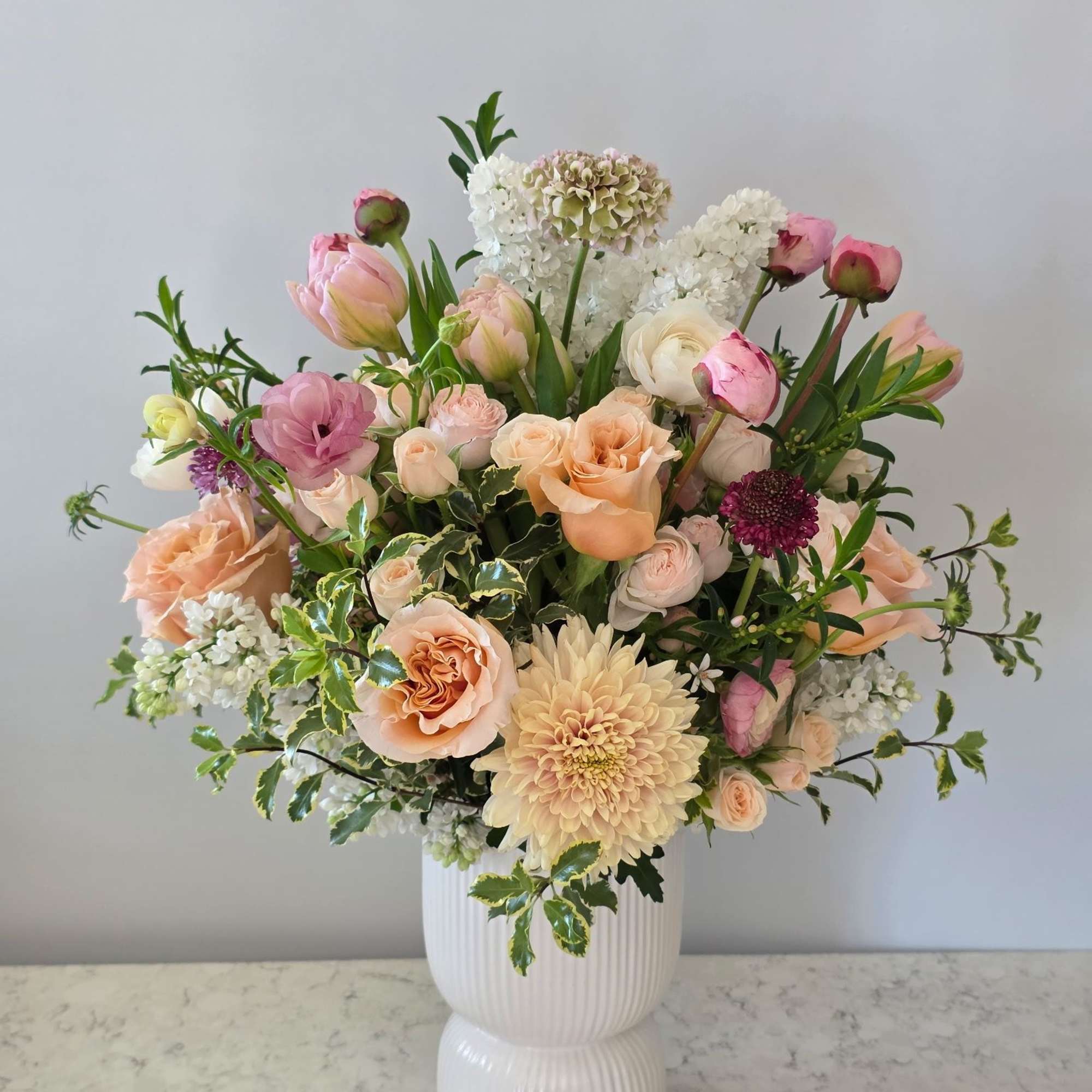 Sweet Darling is a romantic garden-style arrangement designed to celebrate love in