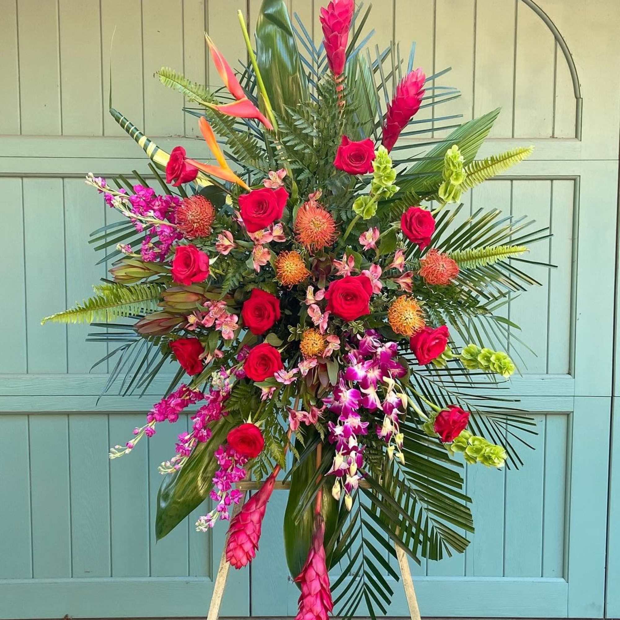 A bold and vibrant expression of love and remembrance, the Tropical Tribute