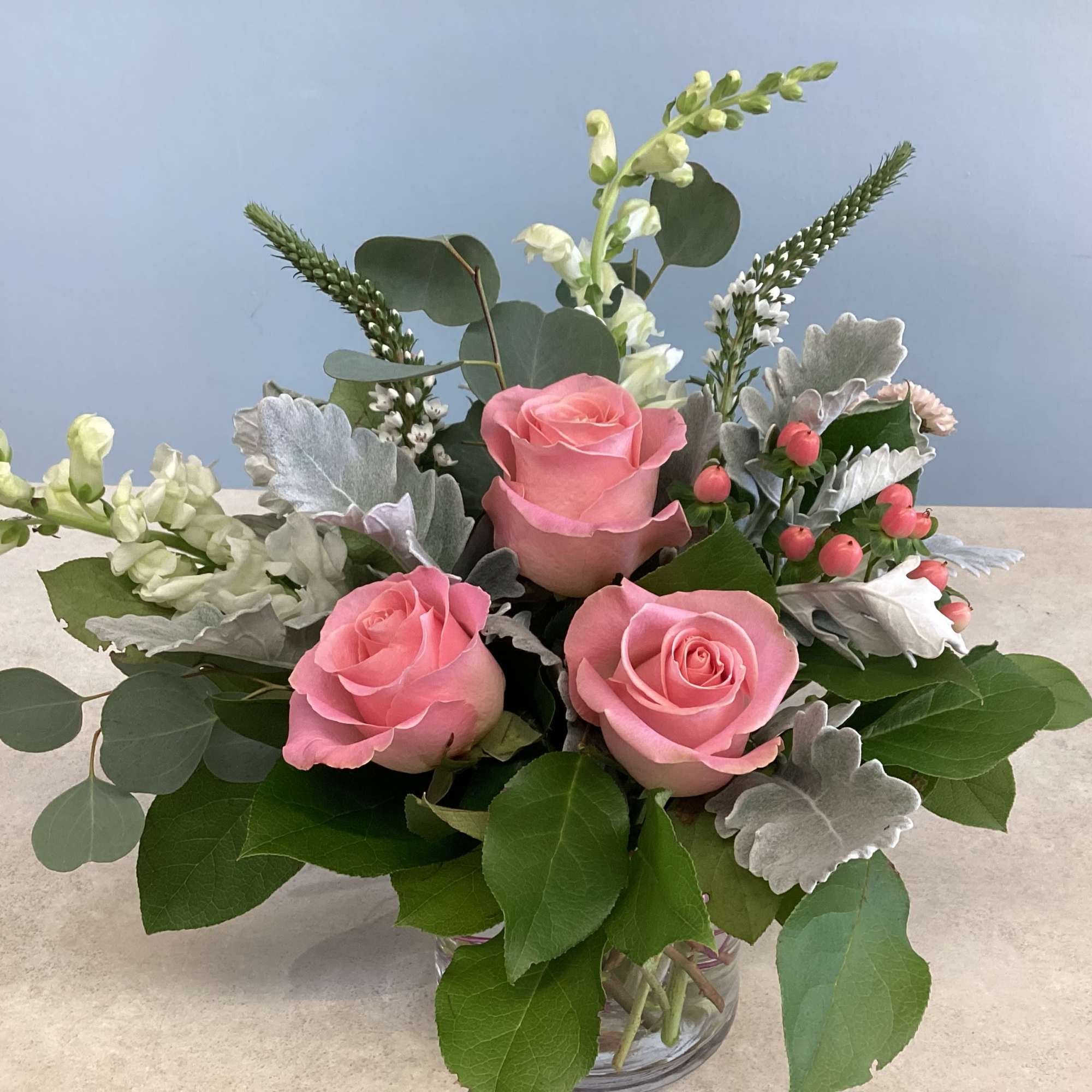 A low-profile arrangement featuring roses.