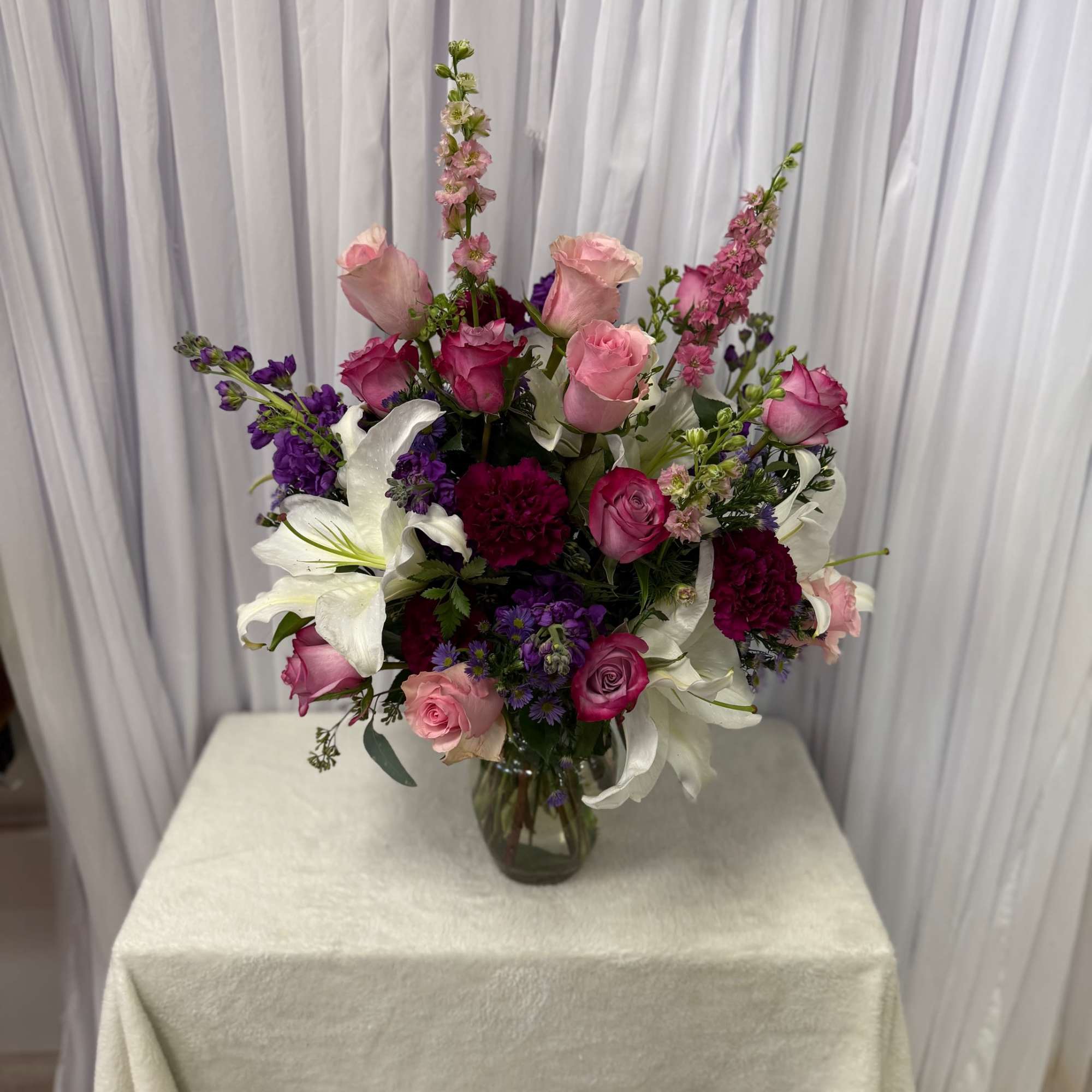 Pink and white mixed bouquet in a glass vase