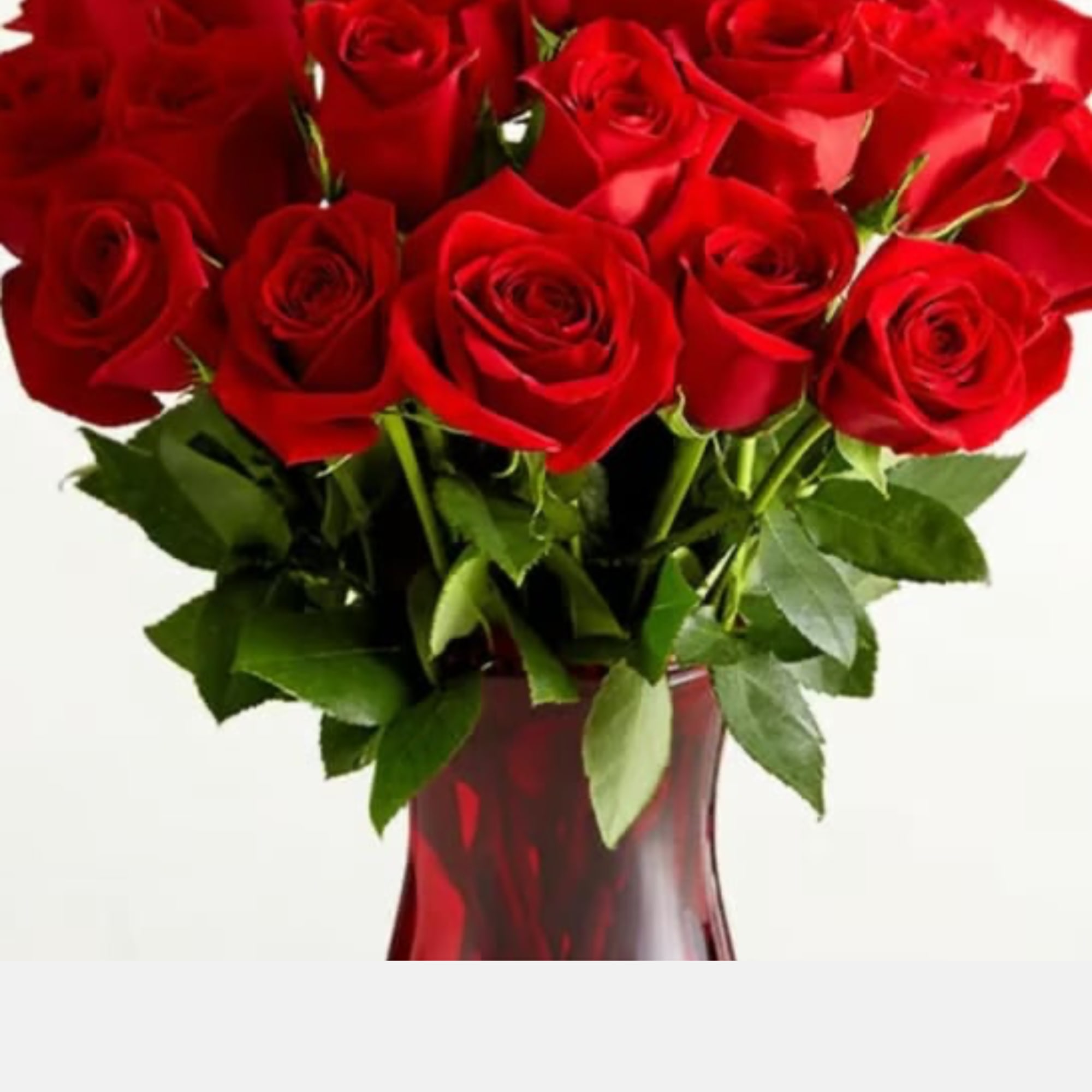Bouquet of red roses in a red glass vase