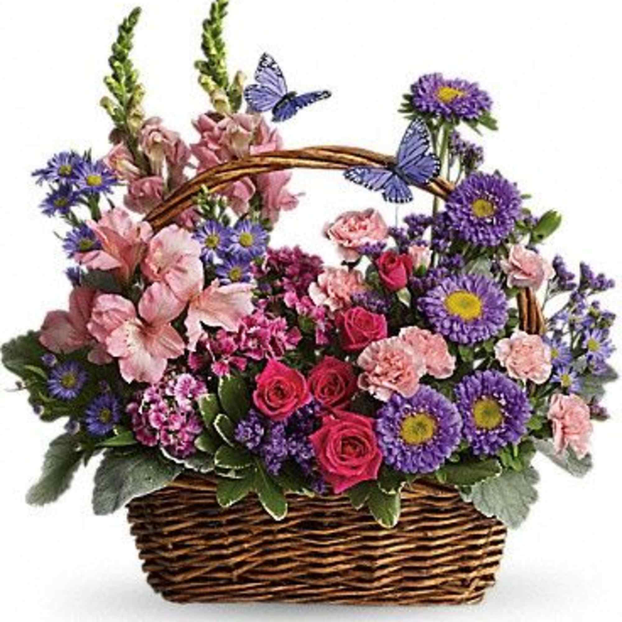 Basket of pink and purple flowers with butterfly decorations