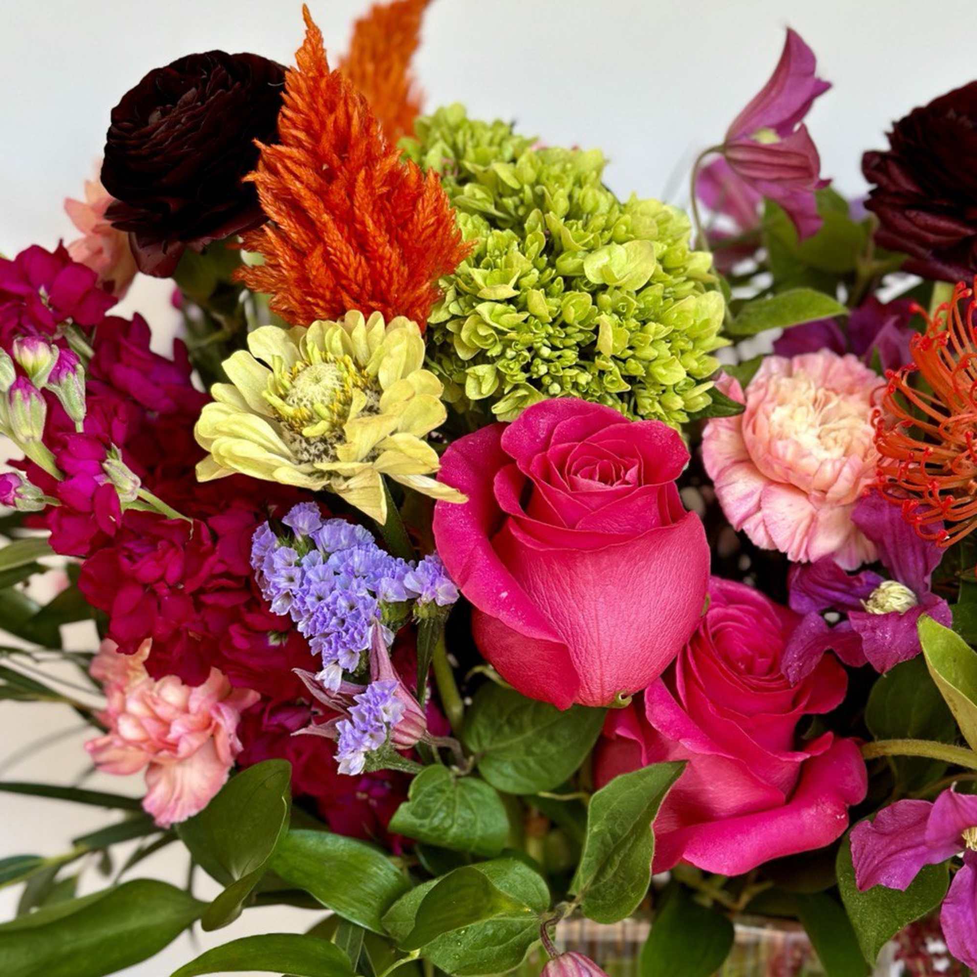 Bright mixed bouquet with pink roses and green hydrangeas
