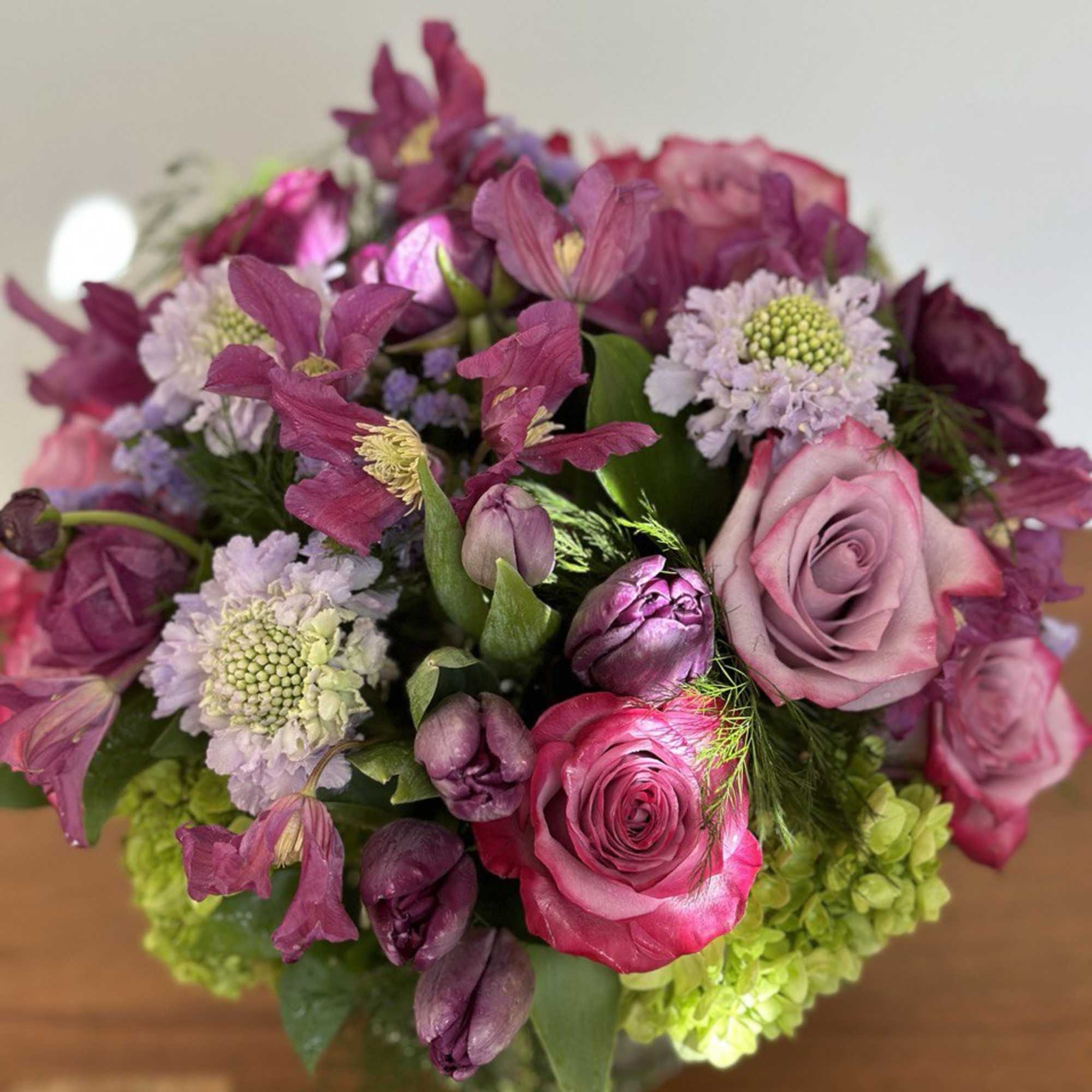 Bouquet of pink and purple flowers with roses and hydrangea
