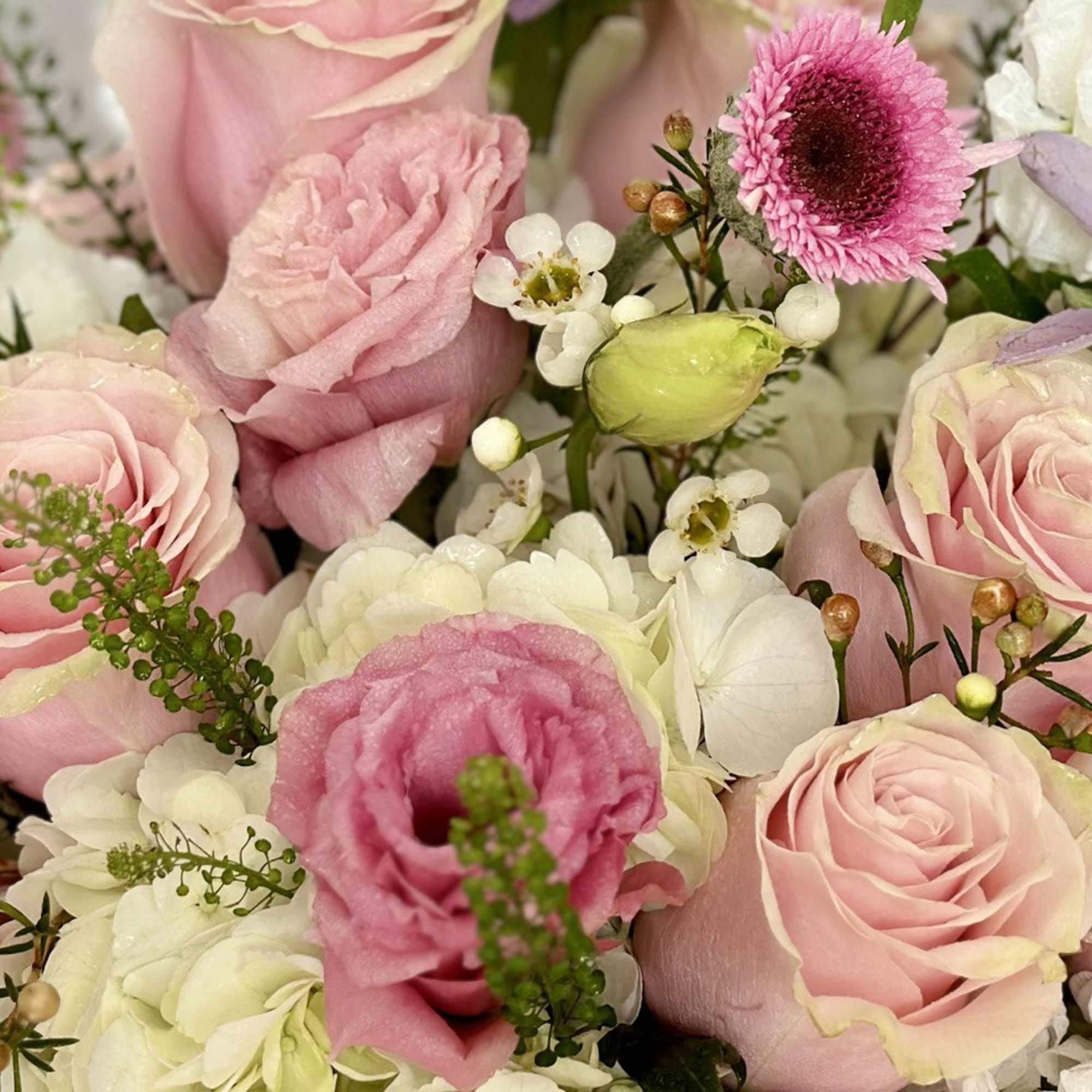 Pink and white mixed bouquet with roses and small accent flowers